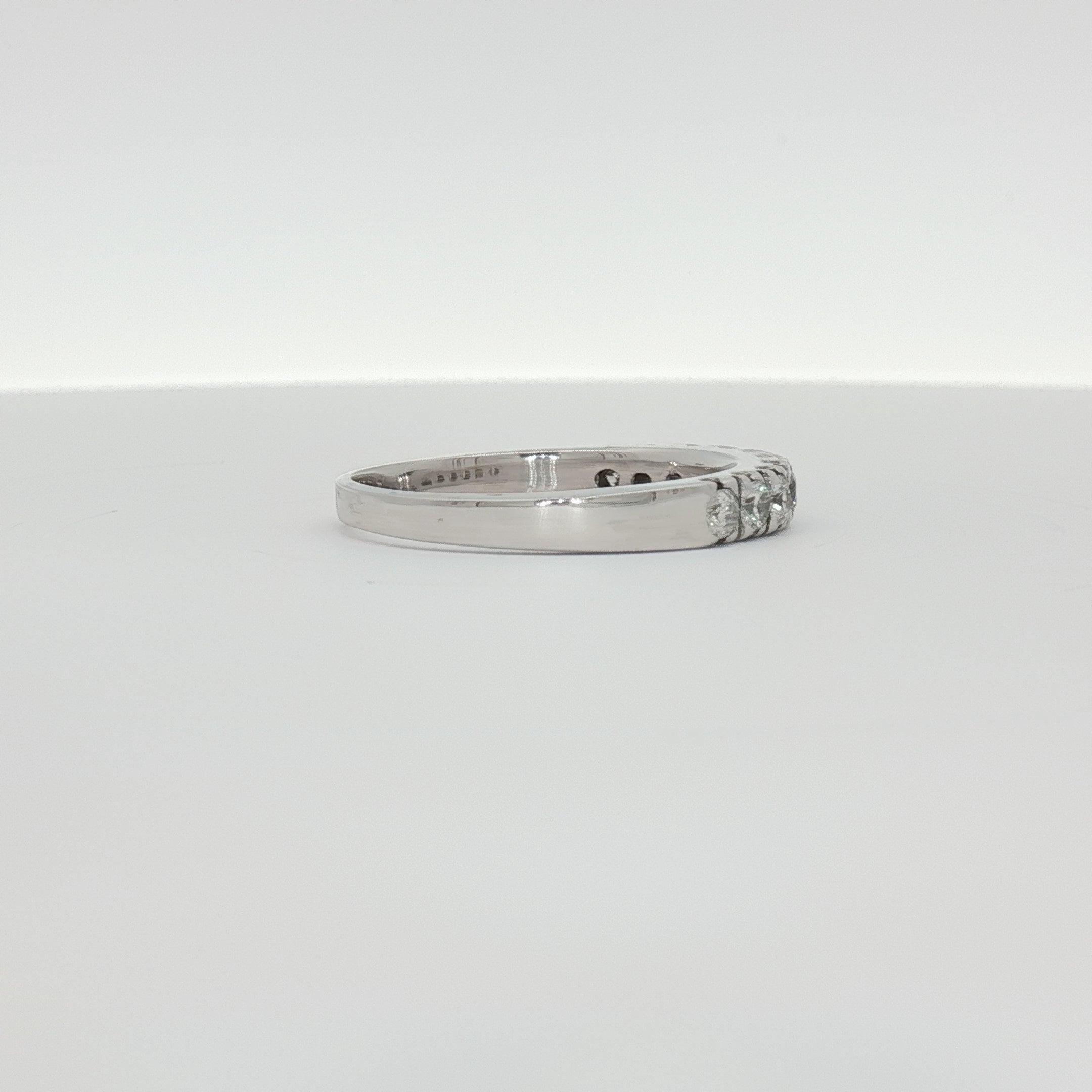 14K white gold diamond wedding band with sparkling diamonds, elegant jewelry piece from Gold & Beyond.
