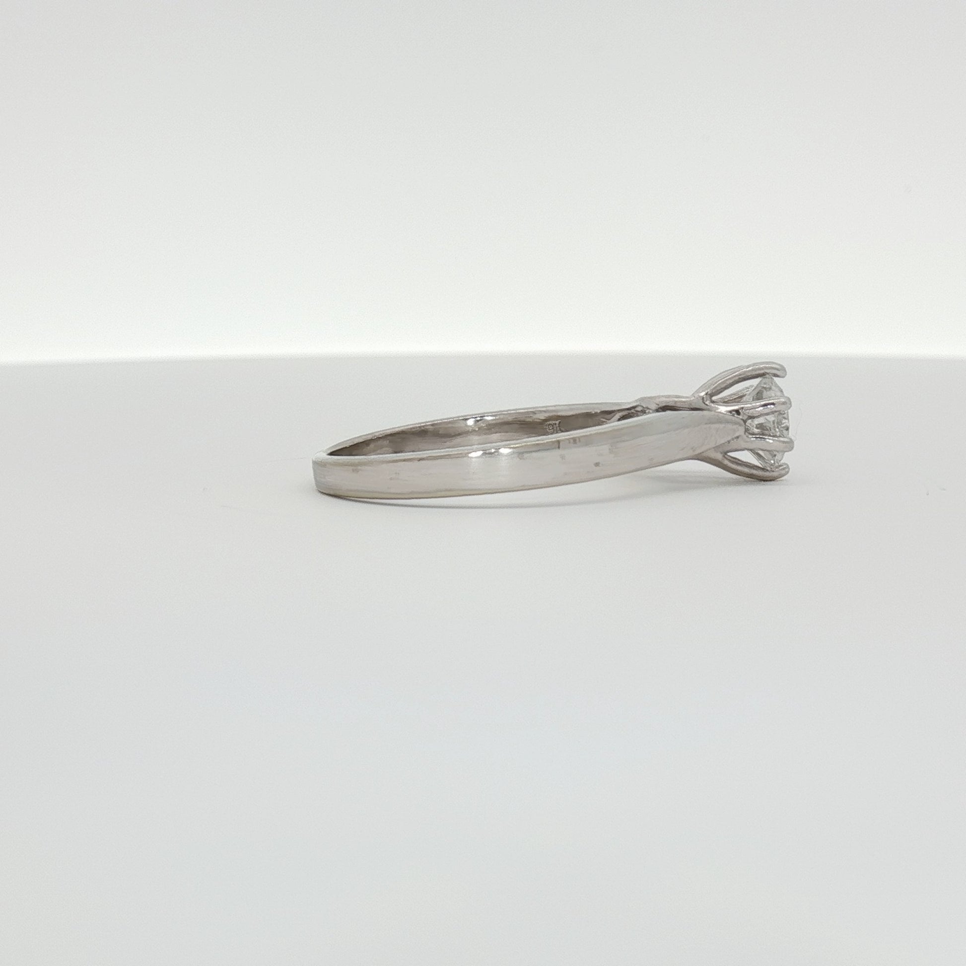 10K white gold diamond solitaire ring with a central sparkling diamond, elegant jewelry piece from Gold & Beyond