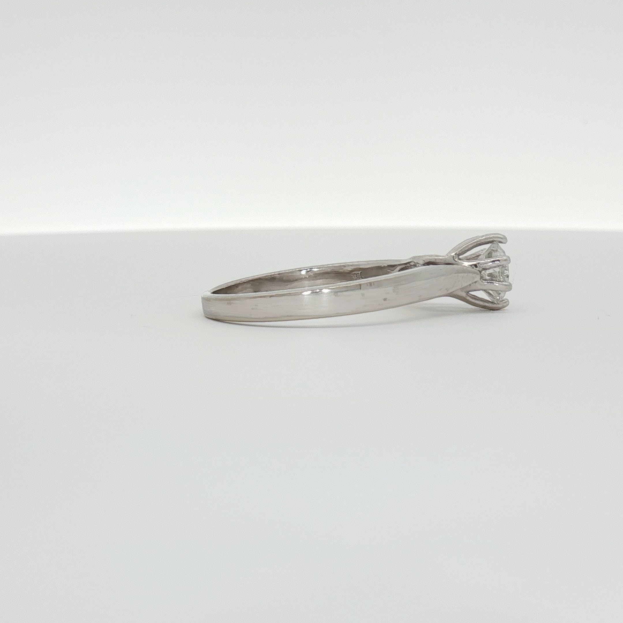 10K white gold diamond solitaire ring with a central sparkling diamond, elegant jewelry piece from Gold & Beyond