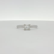 14K white gold diamond solitaire engagement ring featuring a central sparkling diamond and a sleek, elegant band.
