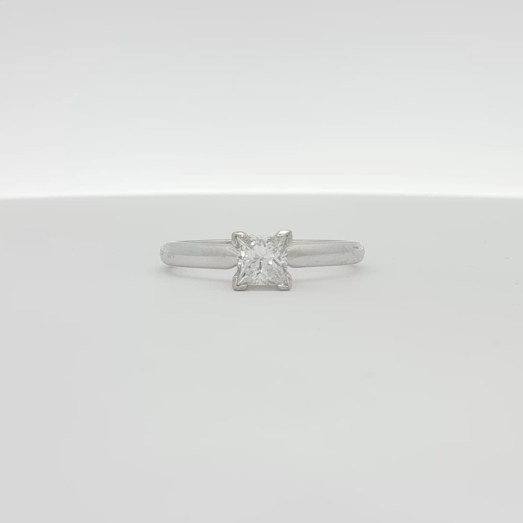 14K white gold diamond solitaire engagement ring with a prominent central diamond and a sleek band from Gold & Beyond.