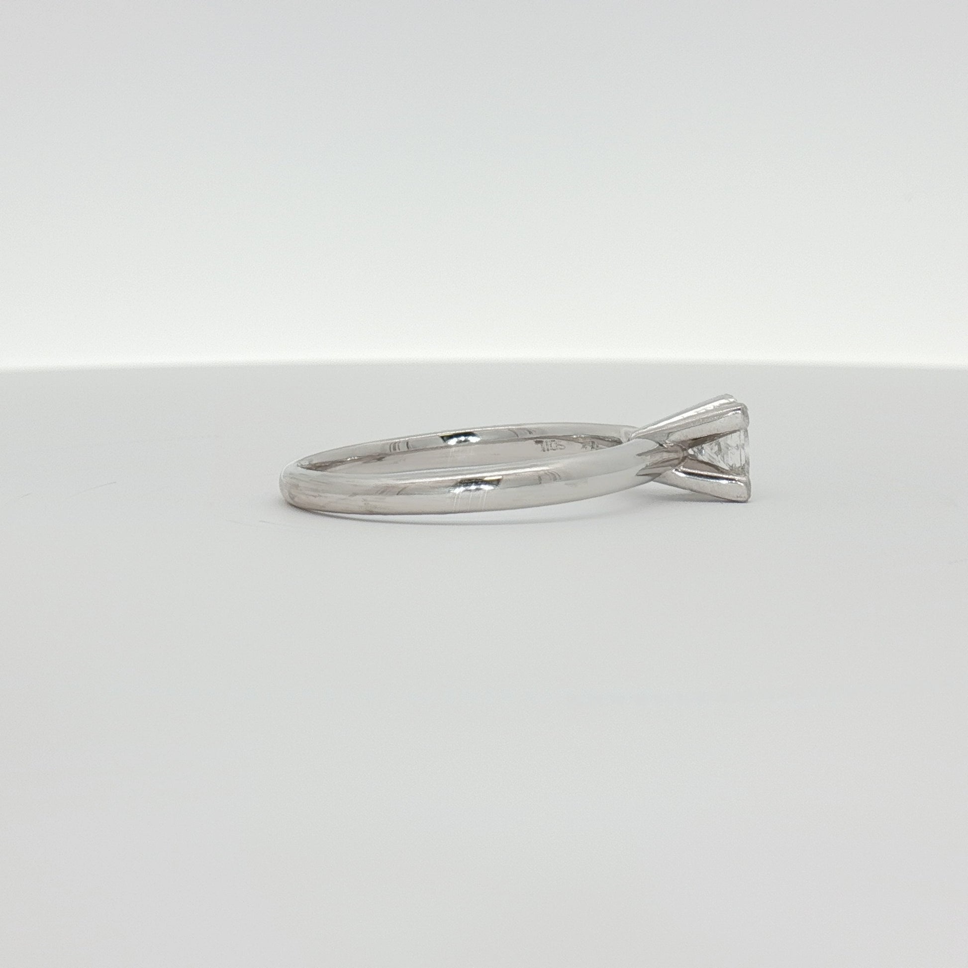 14K white gold diamond solitaire engagement ring with a sparkling central diamond and sleek band from Gold & Beyond jewelry collection.