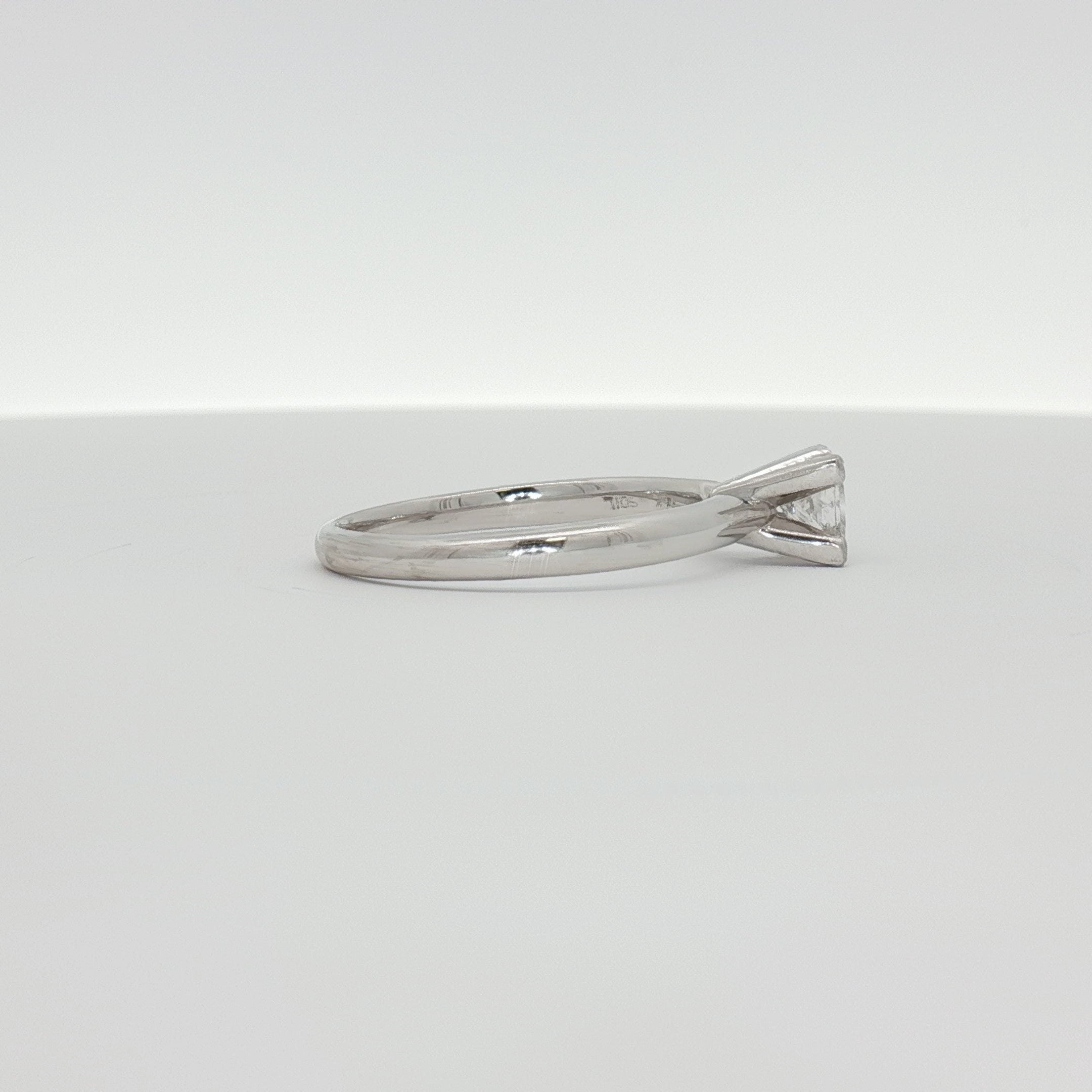 14K white gold diamond solitaire engagement ring with a sparkling central diamond and sleek band from Gold & Beyond jewelry collection.