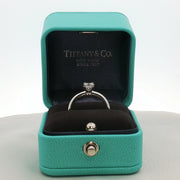 Platinum diamond solitaire ring from Tiffany & Co. featuring a single sparkling diamond set in elegant jewelry style.