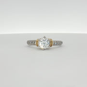 Platinum diamond engagement ring from Gold & Beyond featuring a central sparkling diamond set in elegant jewelry design.
