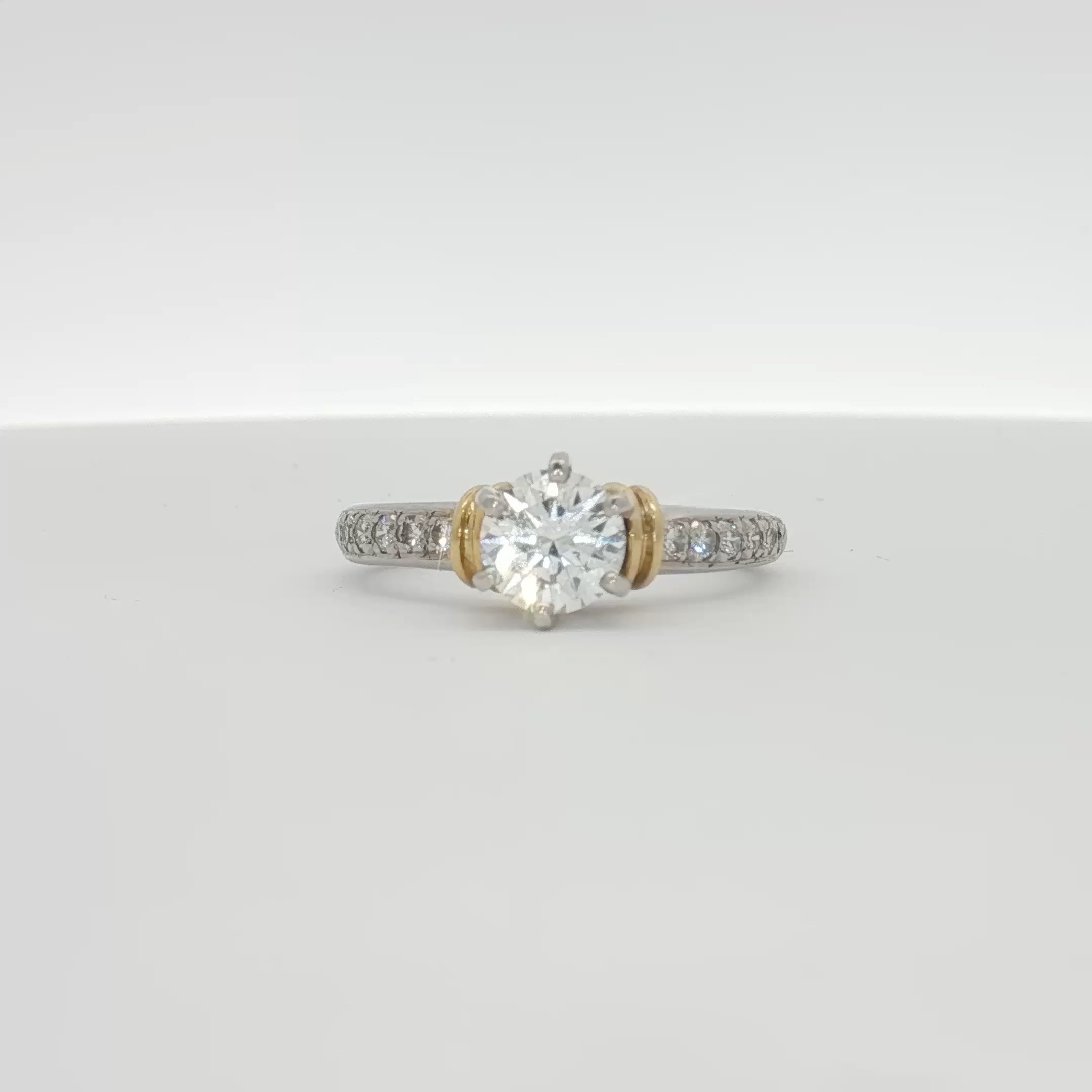 Platinum diamond engagement ring with a central sparkling diamond set in elegant platinum band, from Gold & Beyond jewelry collection.