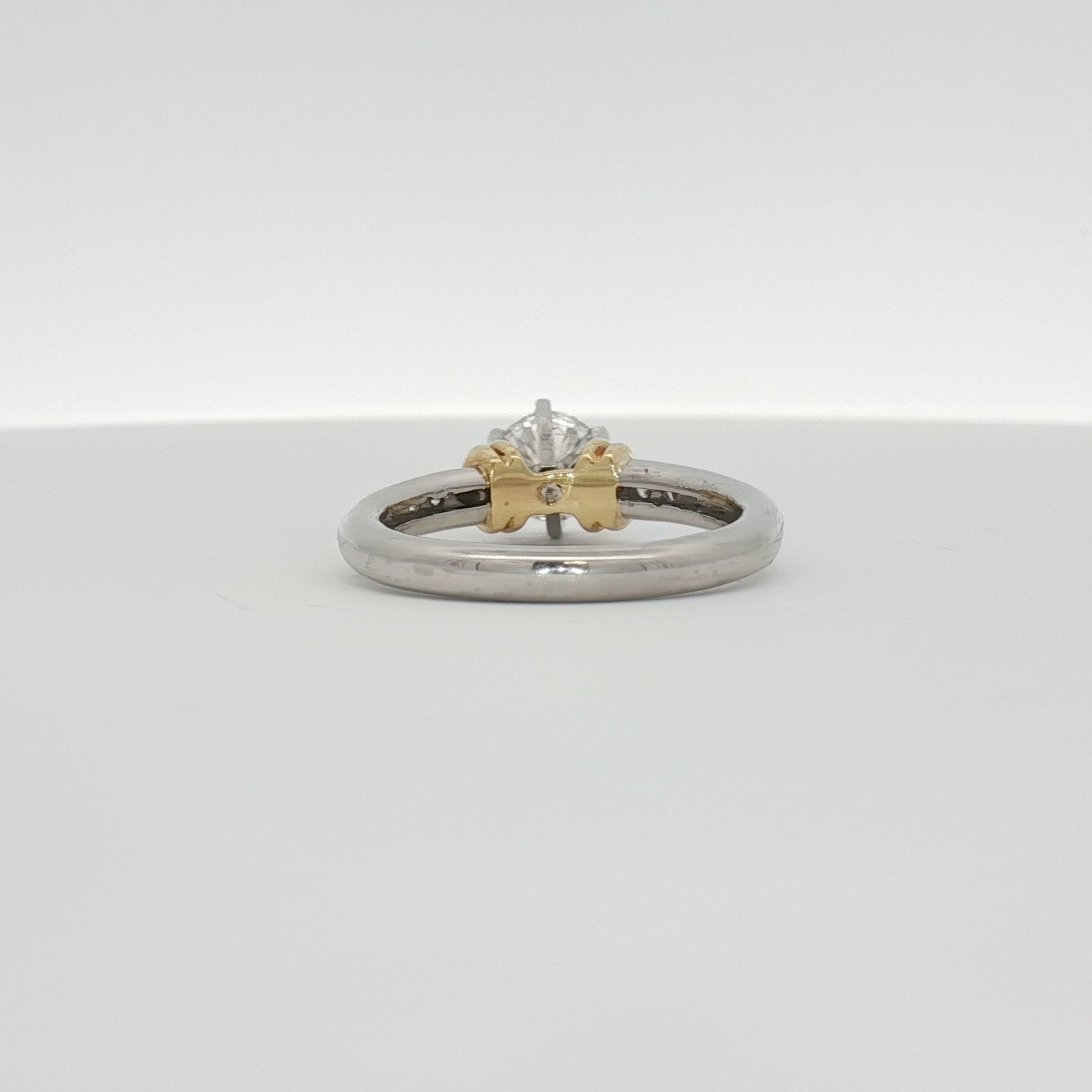 Diamond engagement ring by Gold & Beyond featuring platinum band and sparkling diamonds, elegant jewelry for special occasions.