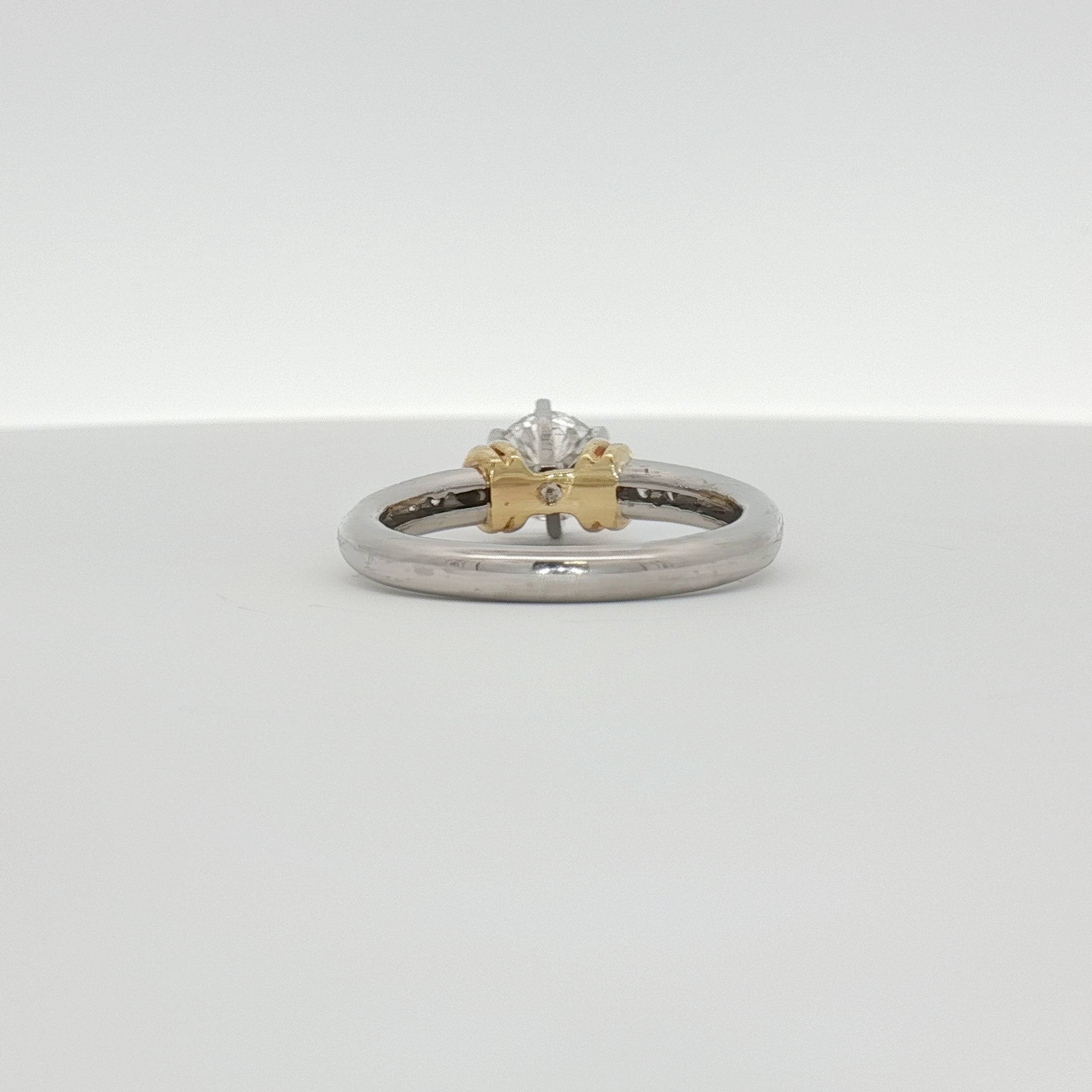 Diamond engagement ring by Gold & Beyond featuring platinum band and sparkling diamonds, elegant jewelry for special occasions.