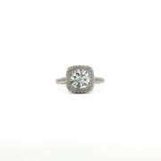 14K white gold diamond halo ring with a central gemstone and smaller accent diamonds, showcasing elegant jewelry design.
