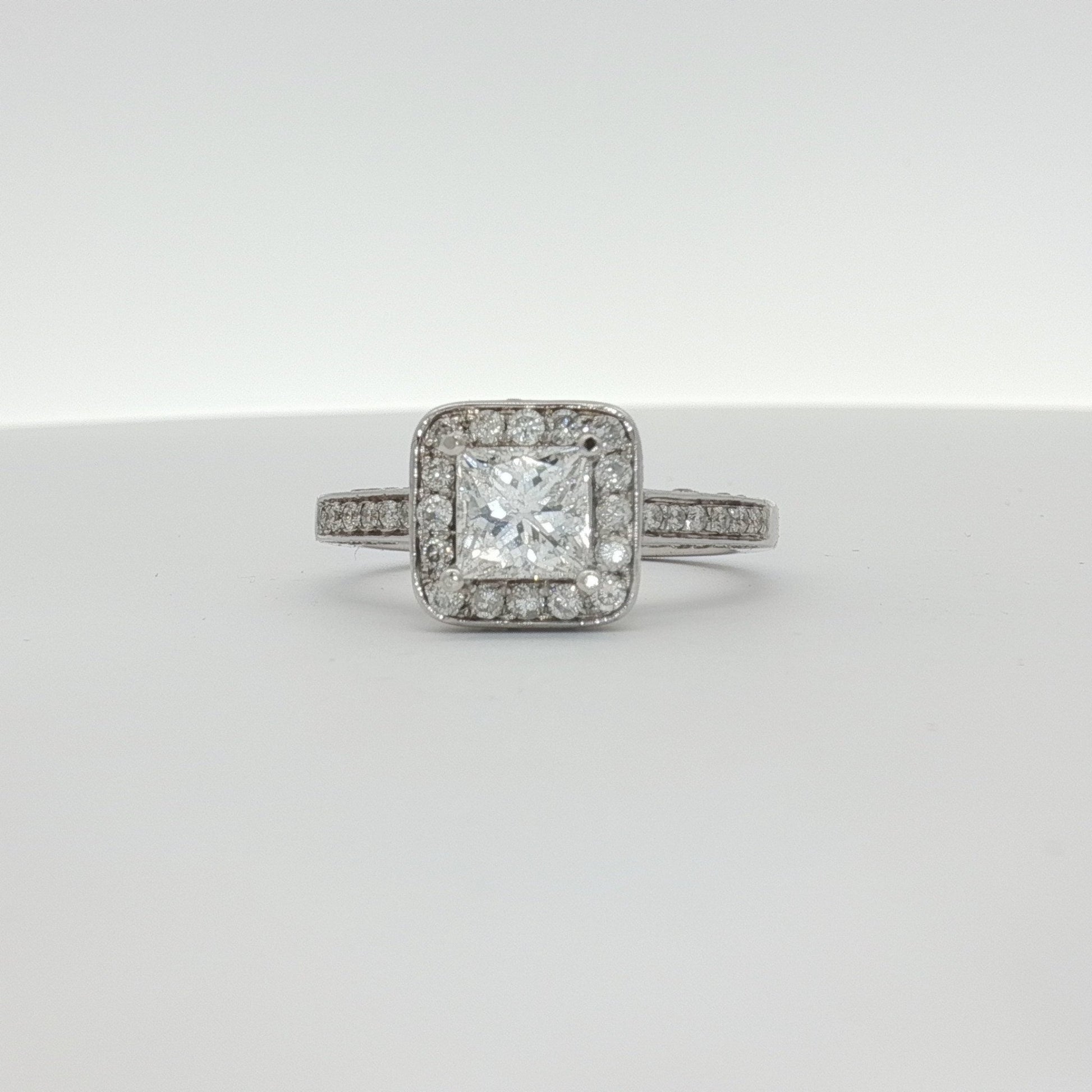 Elegant 18K white gold diamond ring from Gold & Beyond showcasing a sparkling diamond centerpiece and sleek band design.