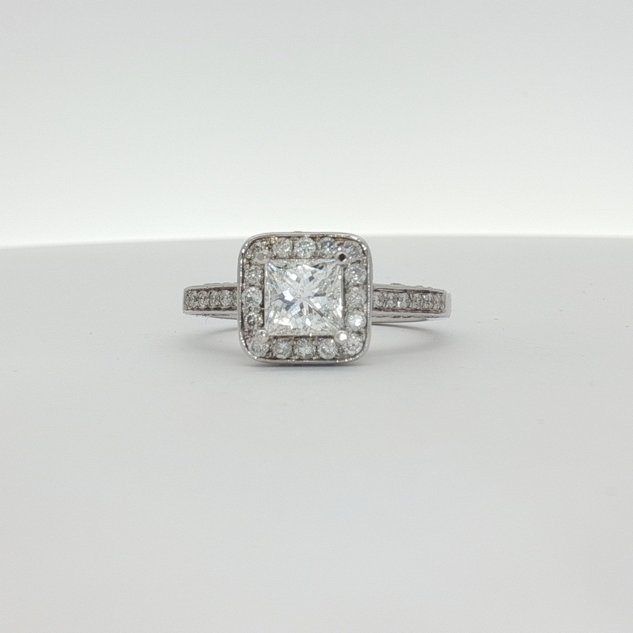 18K white gold diamond ring from Gold & Beyond, showcasing a sparkling diamond set in elegant jewelry style.