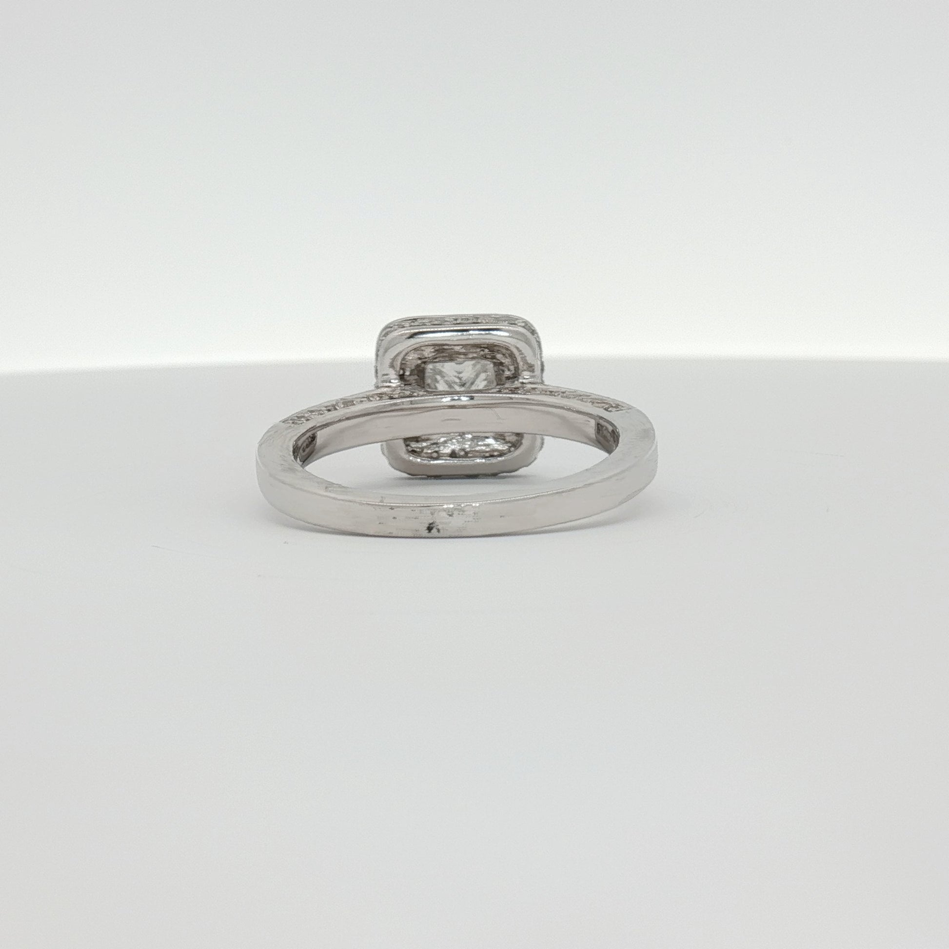 18K white gold diamond ring from Gold & Beyond featuring a sparkling diamond centerpiece and elegant jewelry design
