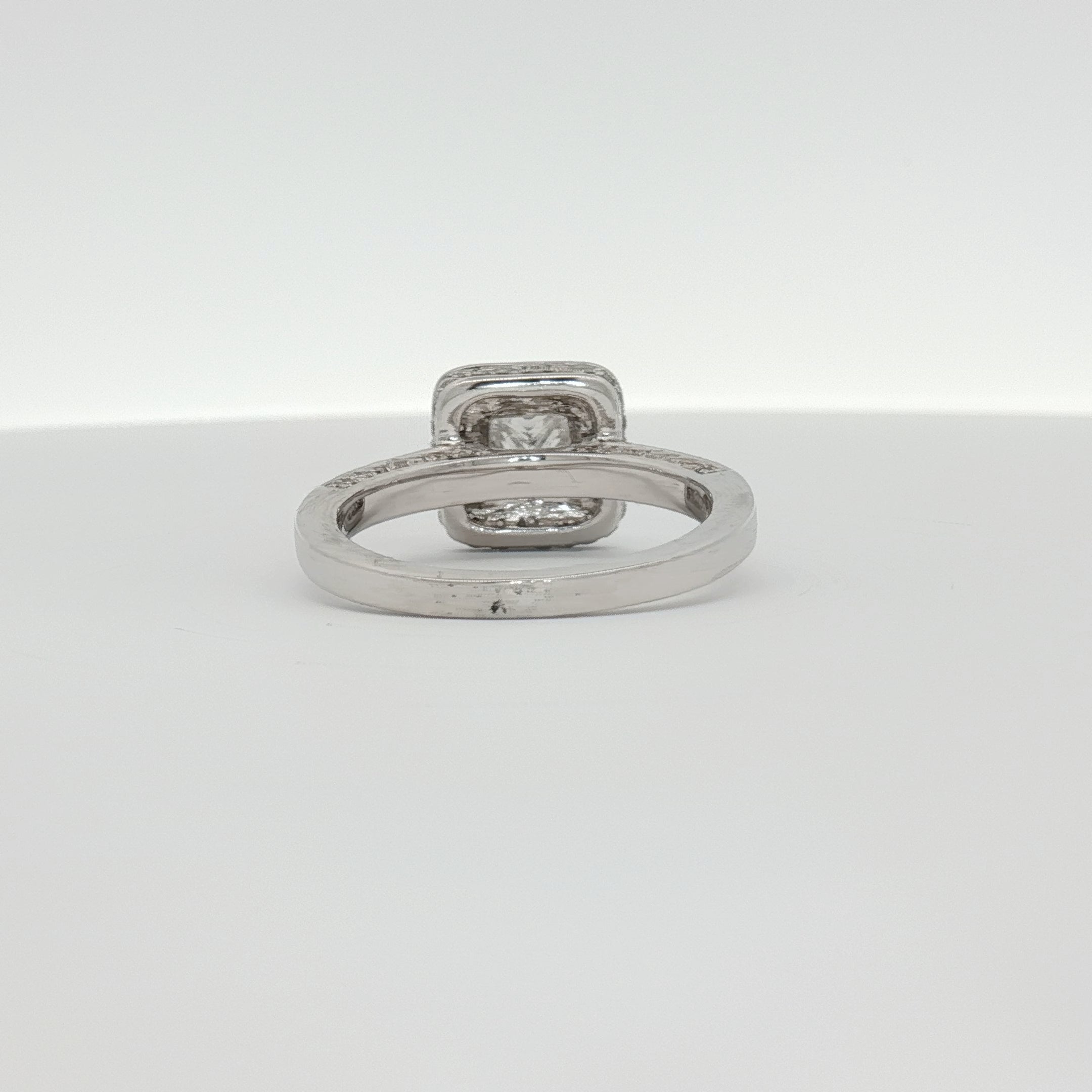 18K white gold diamond ring from Gold & Beyond featuring a sparkling diamond centerpiece and elegant jewelry design