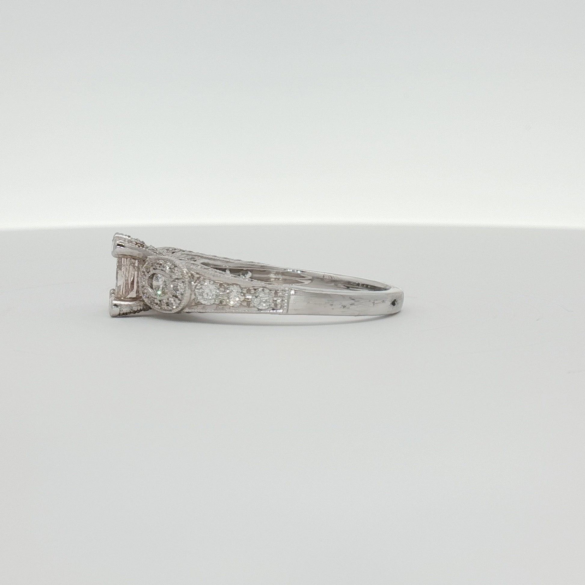 18K white gold diamond ring from Gold & Beyond featuring a sparkling diamond centerpiece and elegant jewelry design.
