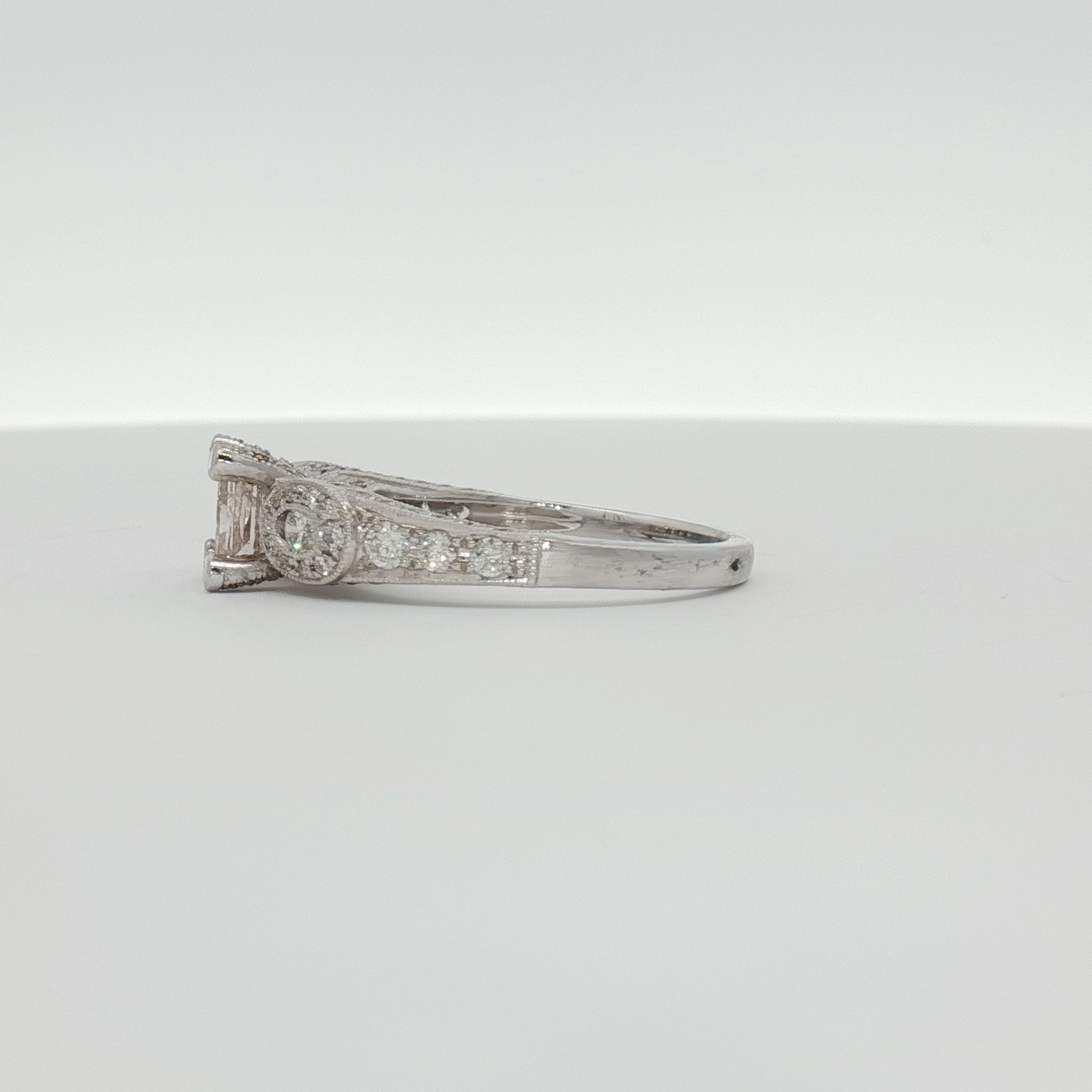 18K white gold diamond ring from Gold & Beyond featuring a sparkling diamond centerpiece and elegant jewelry design.