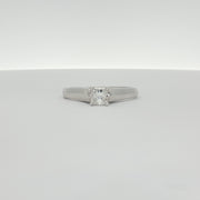18K white gold diamond solitaire engagement ring with a sparkling center stone, crafted by Gold & Beyond.
