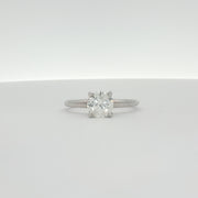 14K white gold diamond engagement ring with a sparkling central diamond and elegant band from Gold & Beyond.