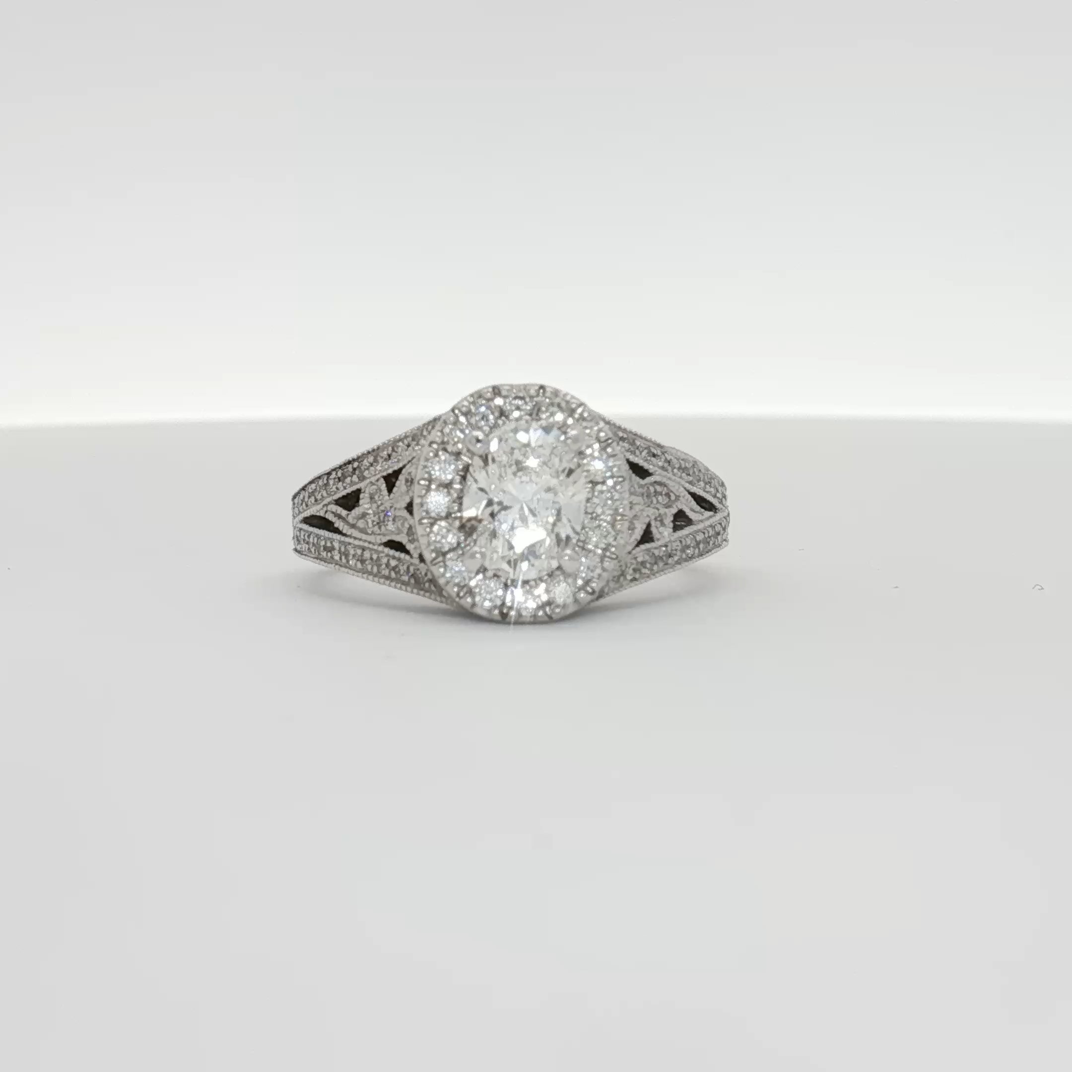 14K white gold diamond engagement ring with a central sparkling diamond and delicate band from Gold & Beyond jewelry collection.