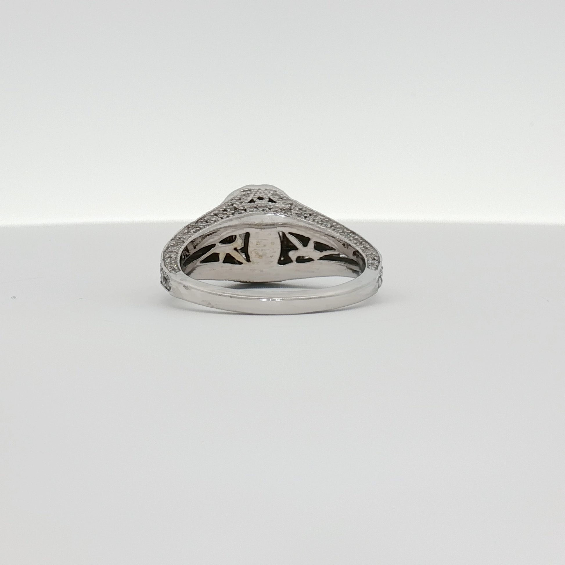 14K white gold diamond engagement ring with a solitaire setting, showcasing sparkling diamonds and a polished band.