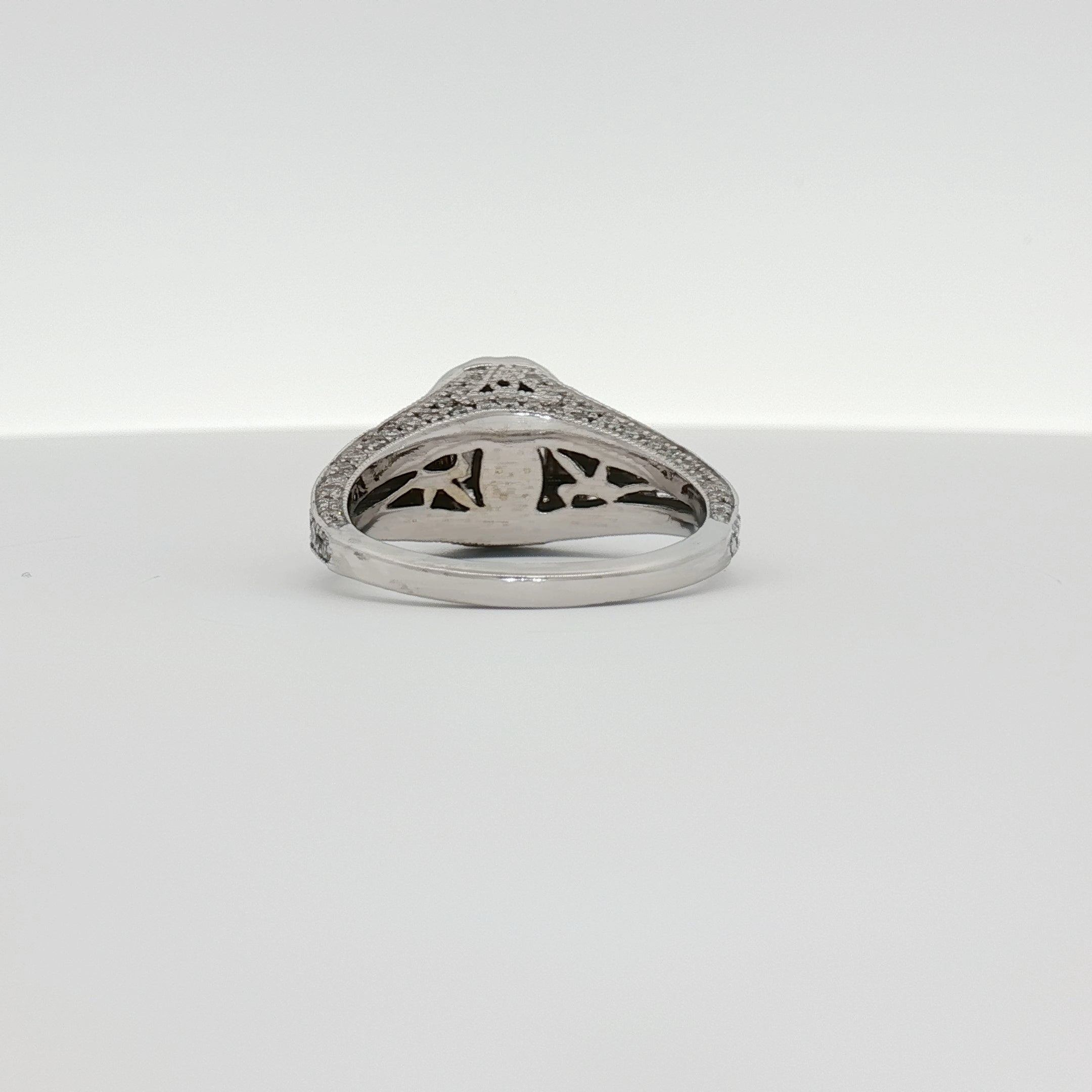 14K white gold diamond engagement ring with a solitaire setting, showcasing sparkling diamonds and a polished band.