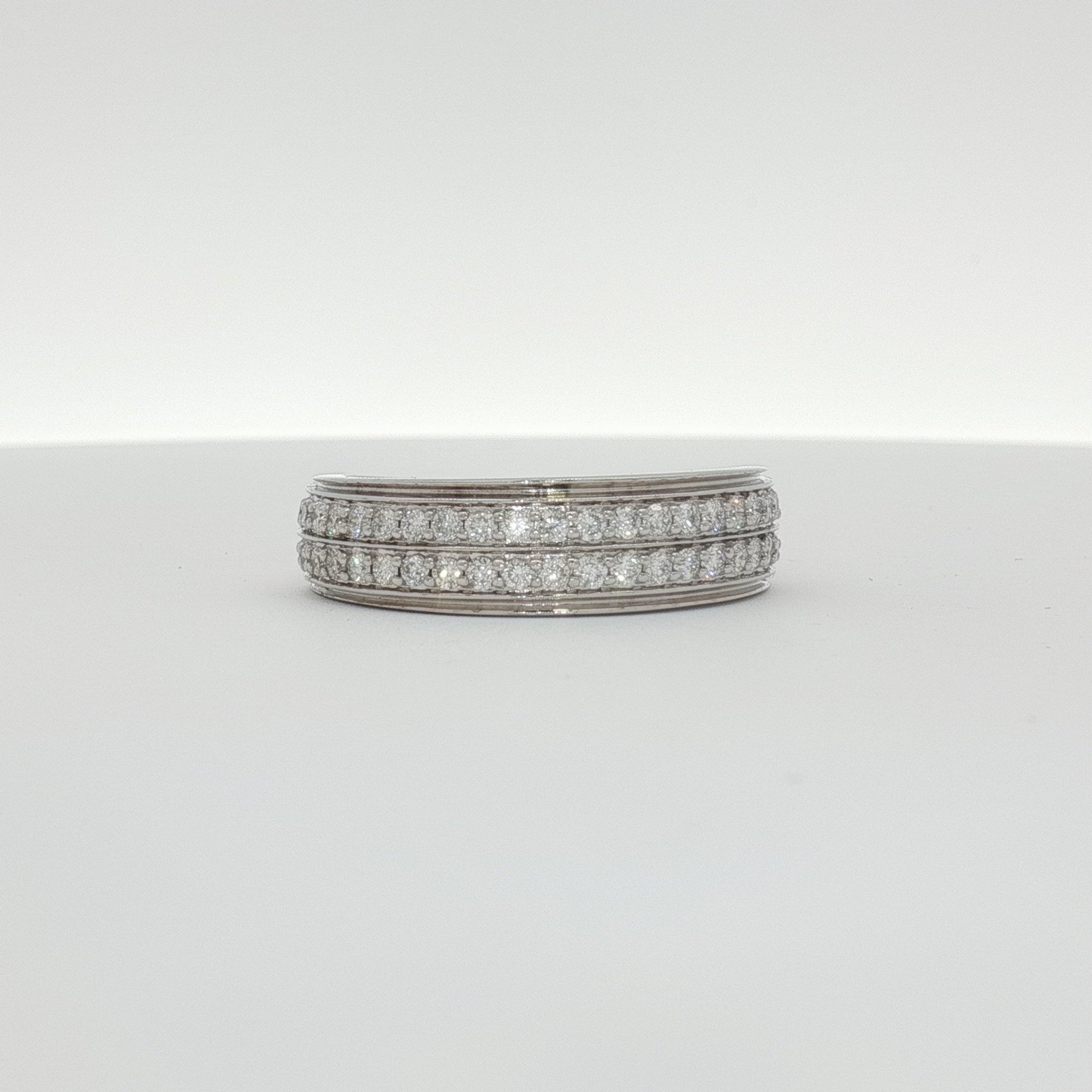 14K white gold diamond gentleman’s band ring featuring a sleek design and sparkling diamonds, jewelry by Gold & Beyond.