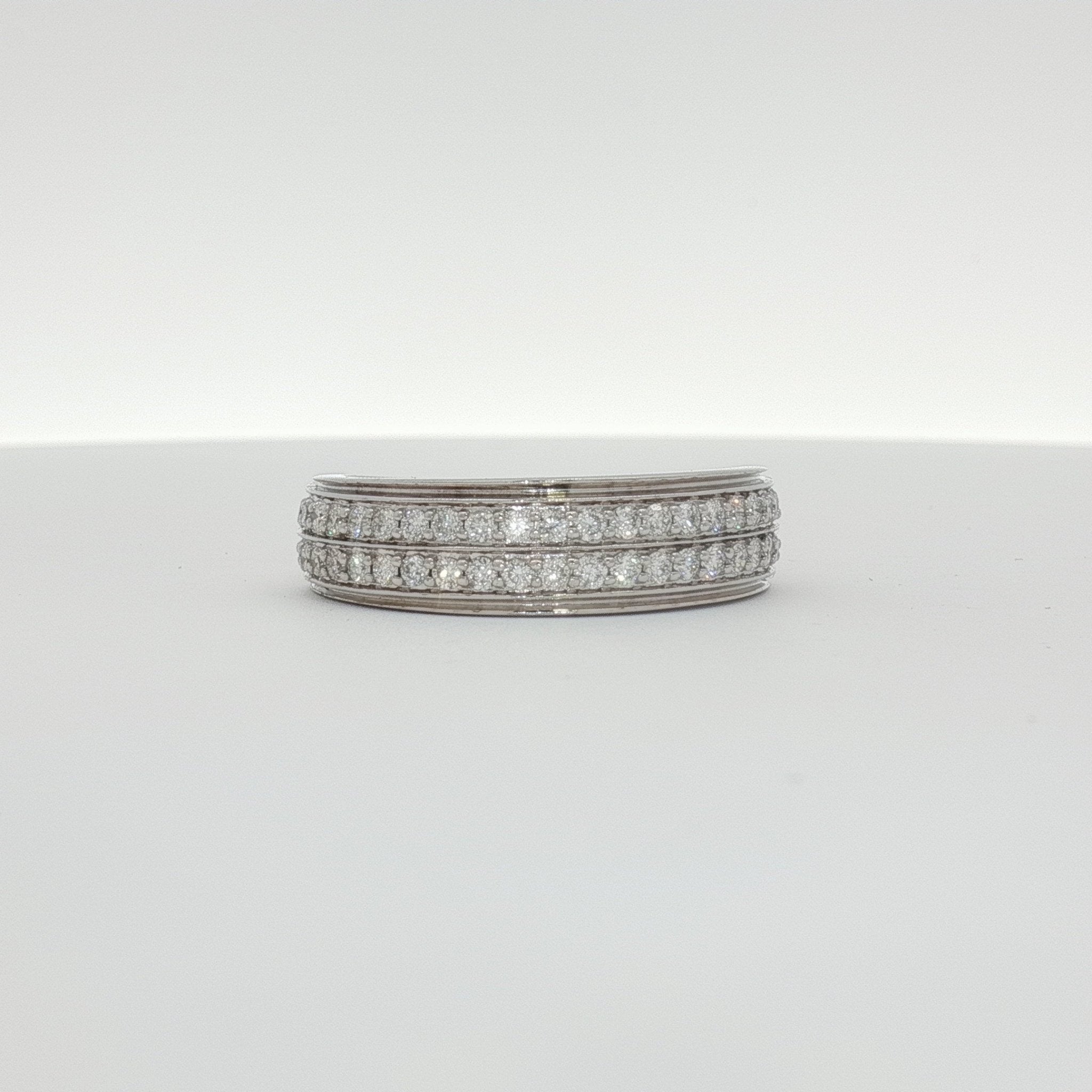 14K white gold diamond gentleman’s band ring featuring a sleek design and sparkling diamonds, jewelry by Gold & Beyond.