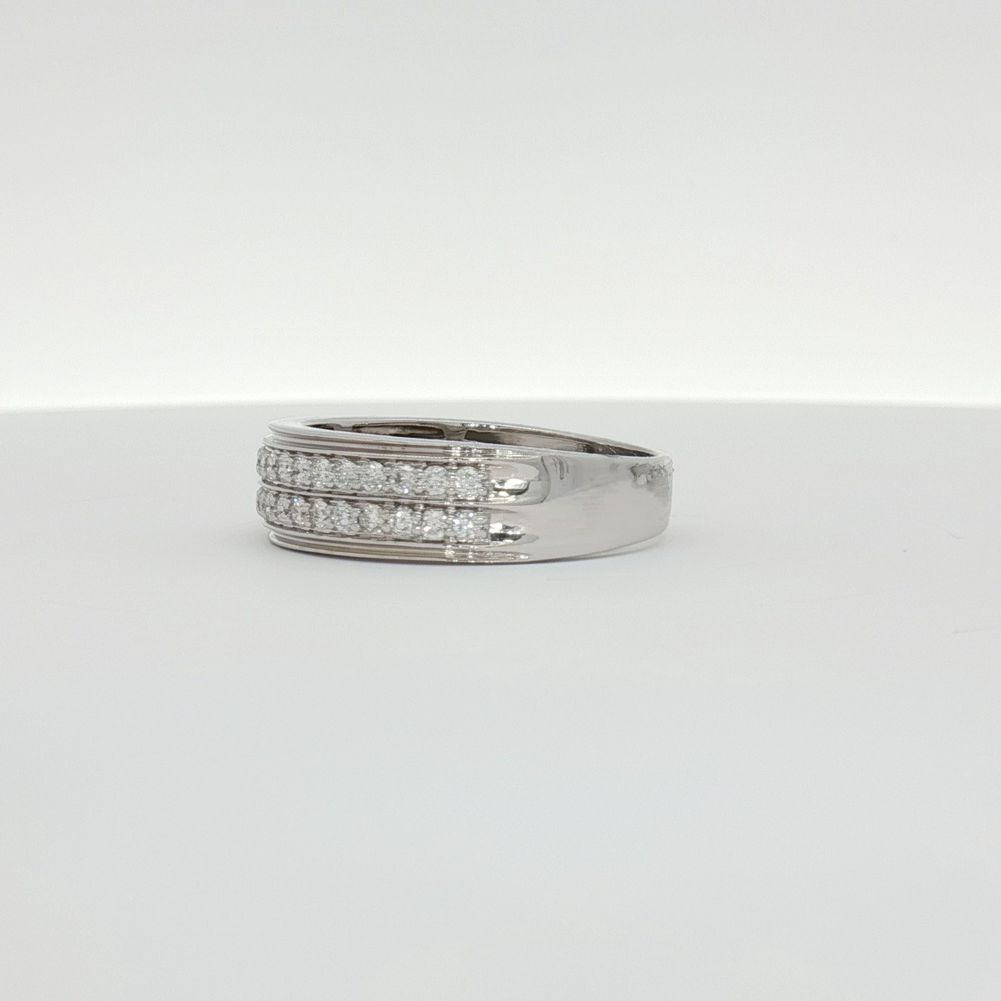 14K white gold diamond men's band ring with sparkling diamonds, crafted by Gold & Beyond, showcasing elegant jewelry design.