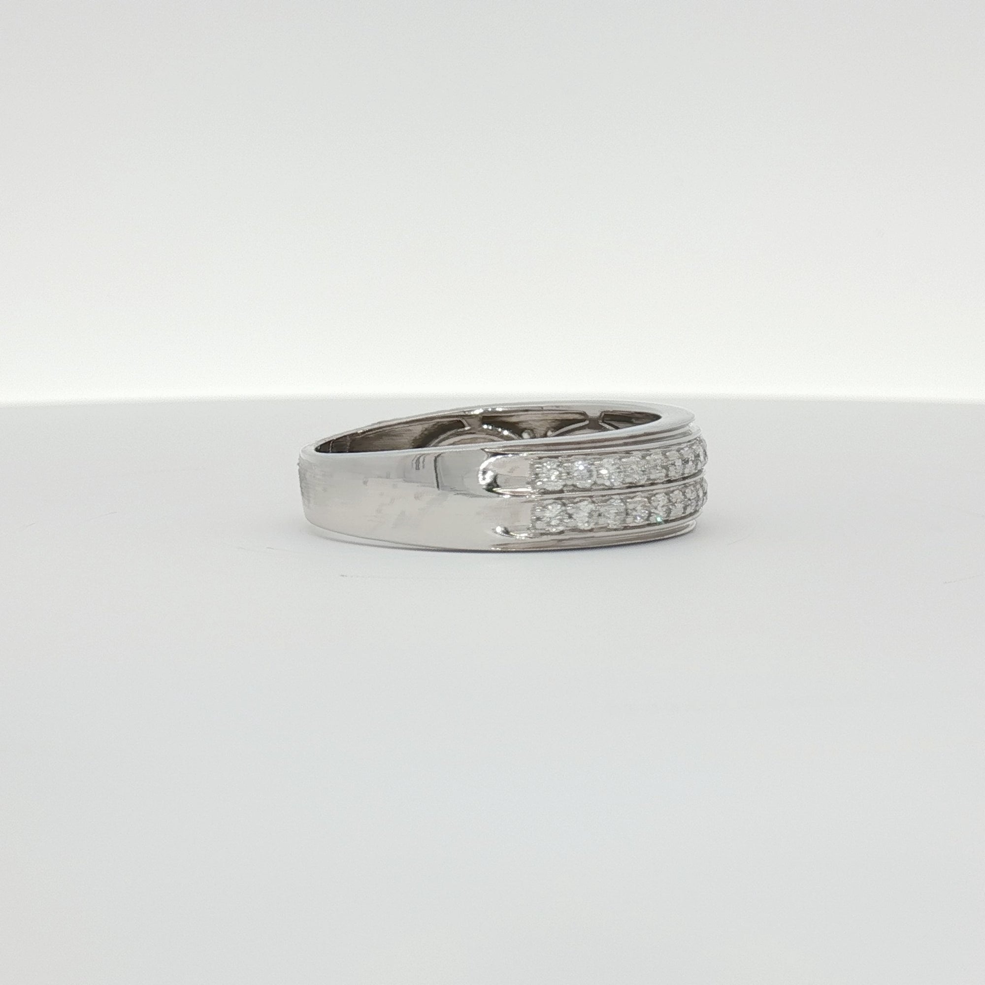 14K white gold diamond gentleman's band ring with a sleek polished finish and sparkling diamond accents, crafted by Gold & Beyond.
