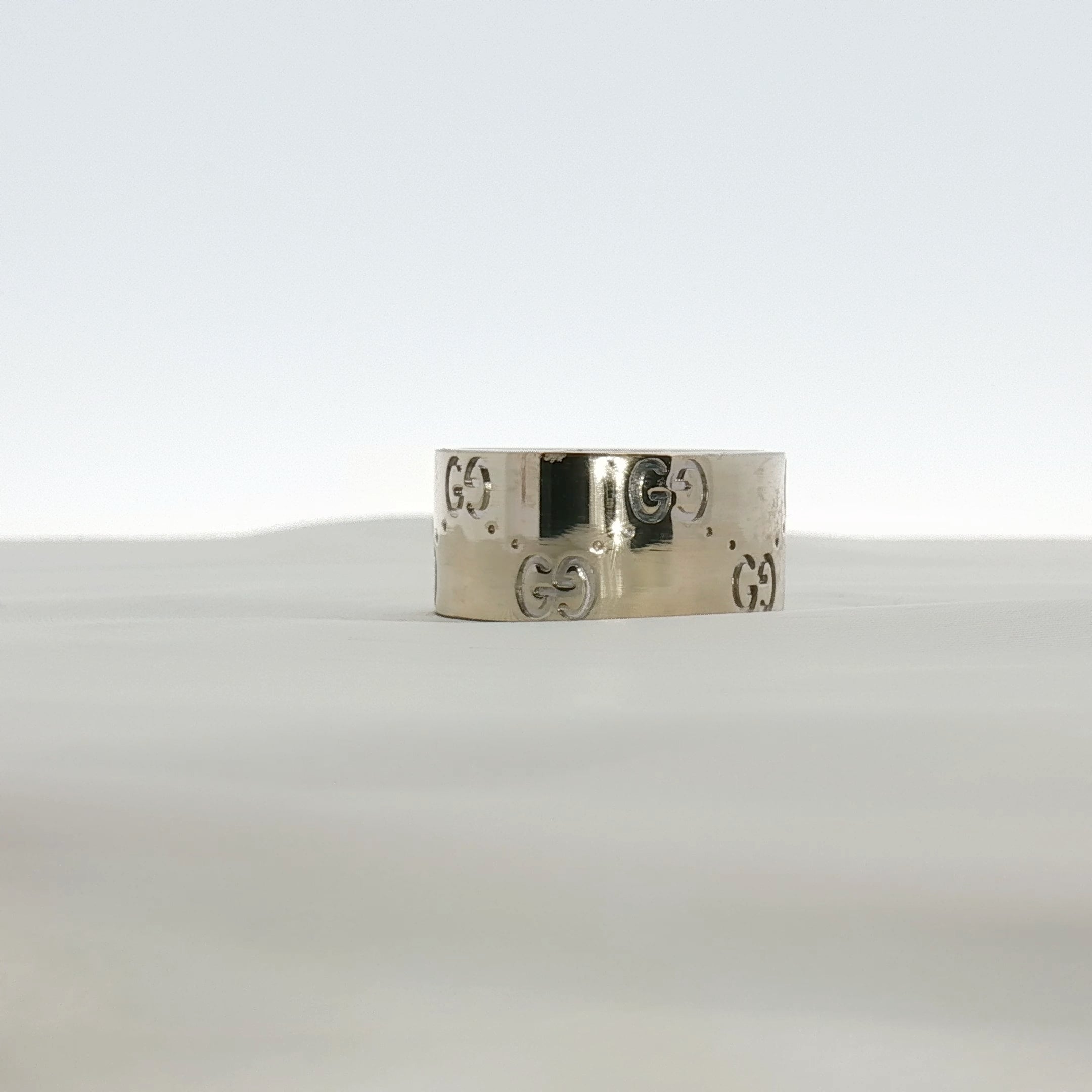 Gold & Beyond Gucci Interlocking G wide band jewelry ring with a polished gold finish and signature logo design.