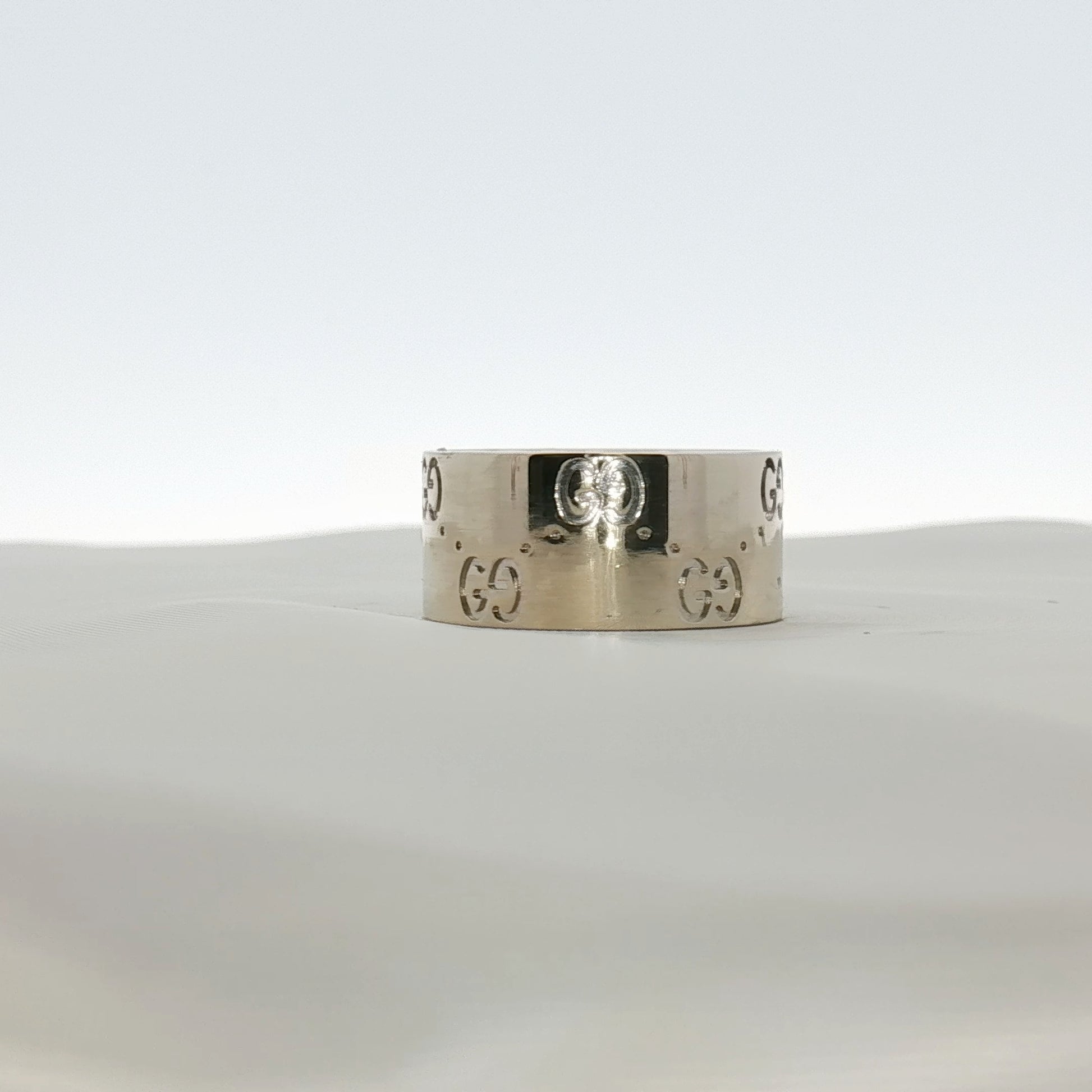 Gold & Beyond Gucci Interlocking G wide band jewelry ring featuring a bold gold-tone design and signature interlocking G pattern.