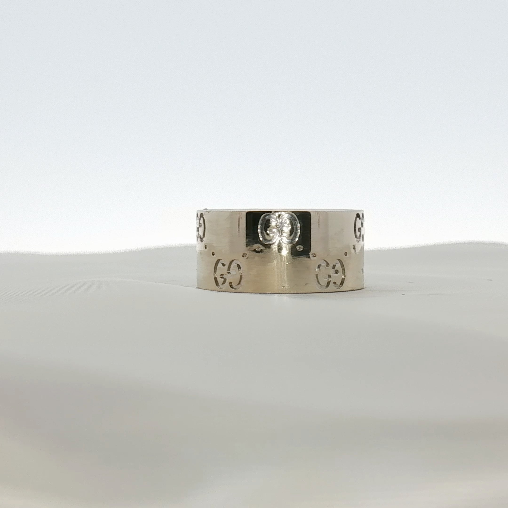 Gold & Beyond Gucci Interlocking G wide band jewelry ring featuring a bold gold-tone design and signature interlocking G pattern.