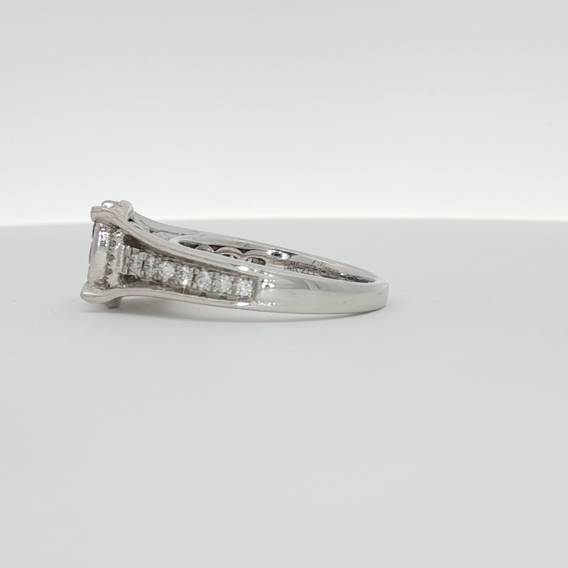 14K white gold diamond cluster ring with sparkling diamonds, showcasing intricate jewelry design from Gold & Beyond.