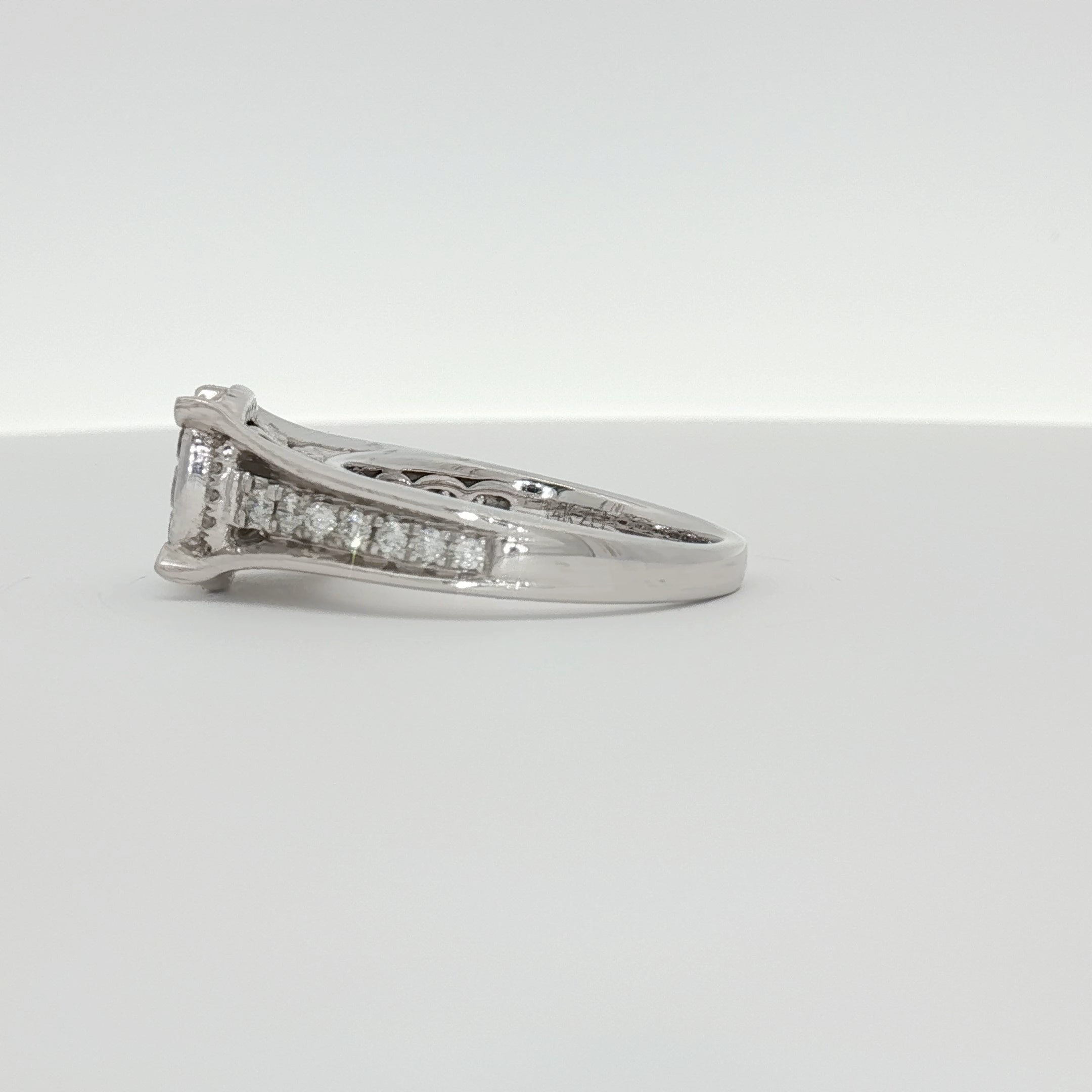 14K white gold diamond cluster ring with sparkling diamonds, showcasing intricate jewelry design from Gold & Beyond.