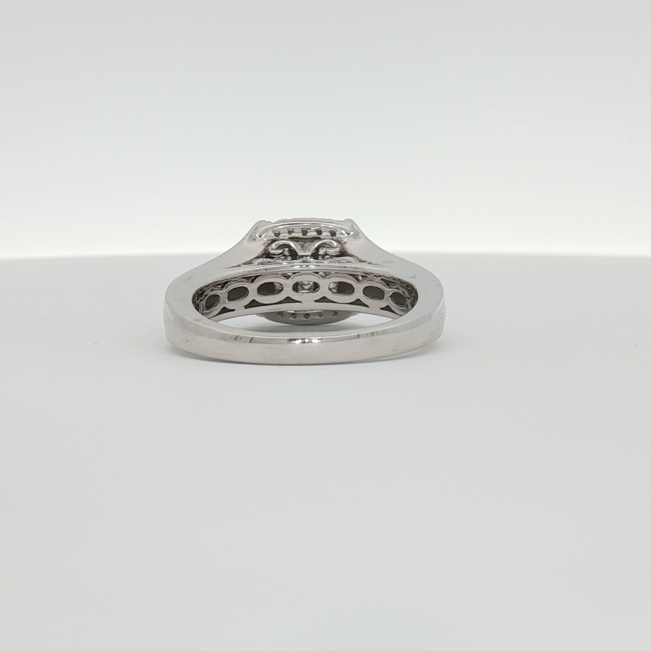 14K white gold diamond cluster ring featuring sparkling diamonds arranged in a stylish jewelry design.
