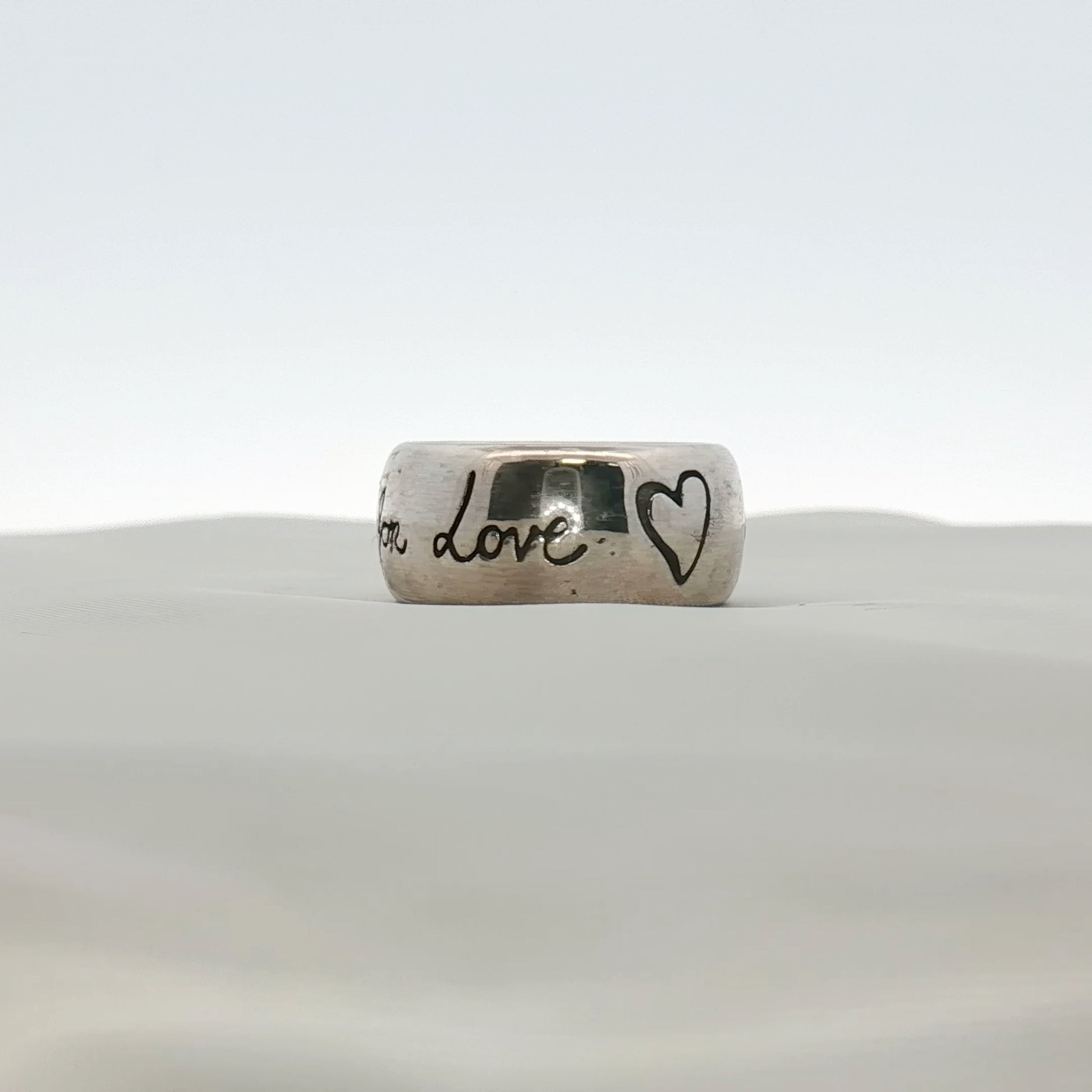 Gold & Beyond Gucci Blind for Love ring, elegant gold jewelry with a distinctive design, shown close-up on a neutral background.
