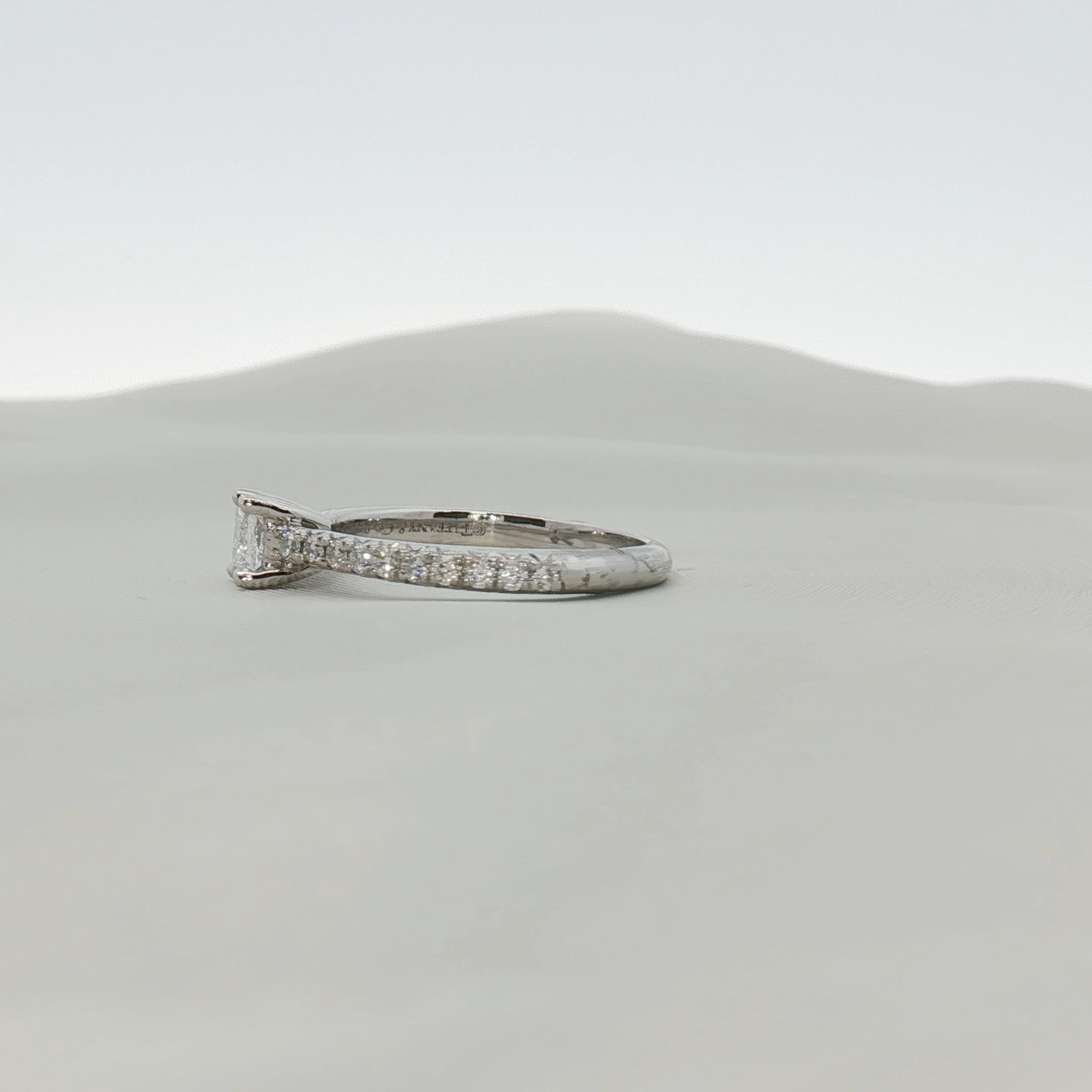 Gold & Beyond Tiffany & Co. pavé diamond solitaire engagement ring featuring a central diamond and intricate pave setting.