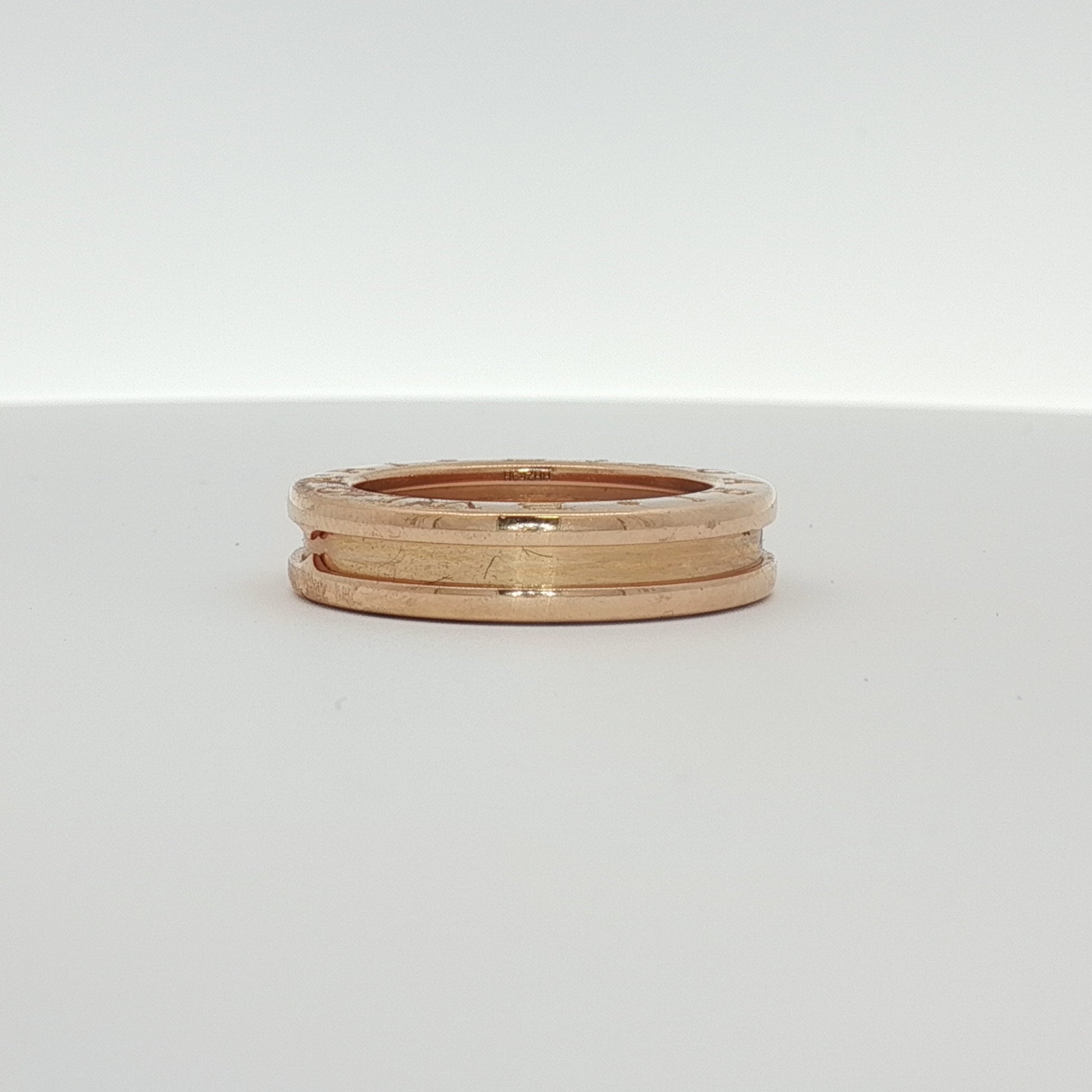 Gold & Beyond Bulgari B.Zero1 jewelry ring featuring a sleek, modern design in gold with distinctive circular motifs.