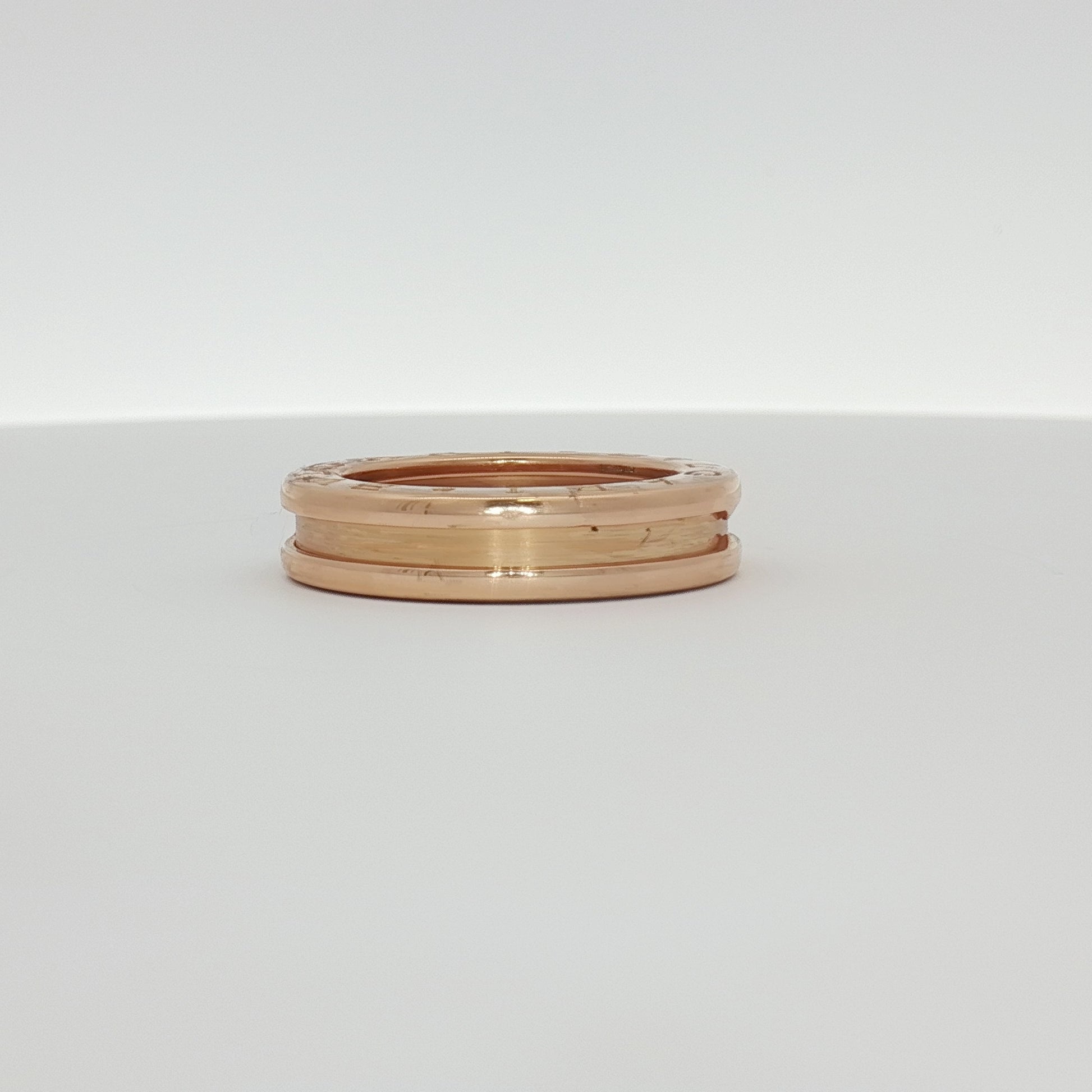 Gold & Beyond Bulgari B.Zero1 ring featuring a sleek, modern design in gold with engraved branding and smooth finish.