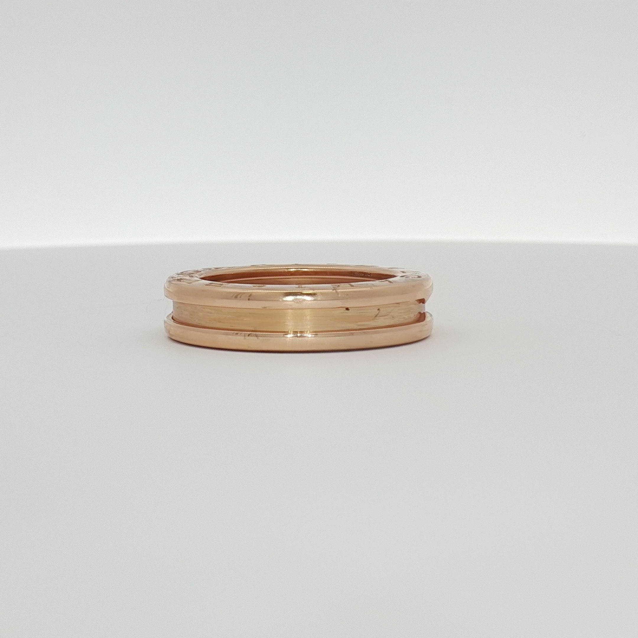 Gold & Beyond Bulgari B.Zero1 ring featuring a sleek, modern design in gold with engraved branding and smooth finish.