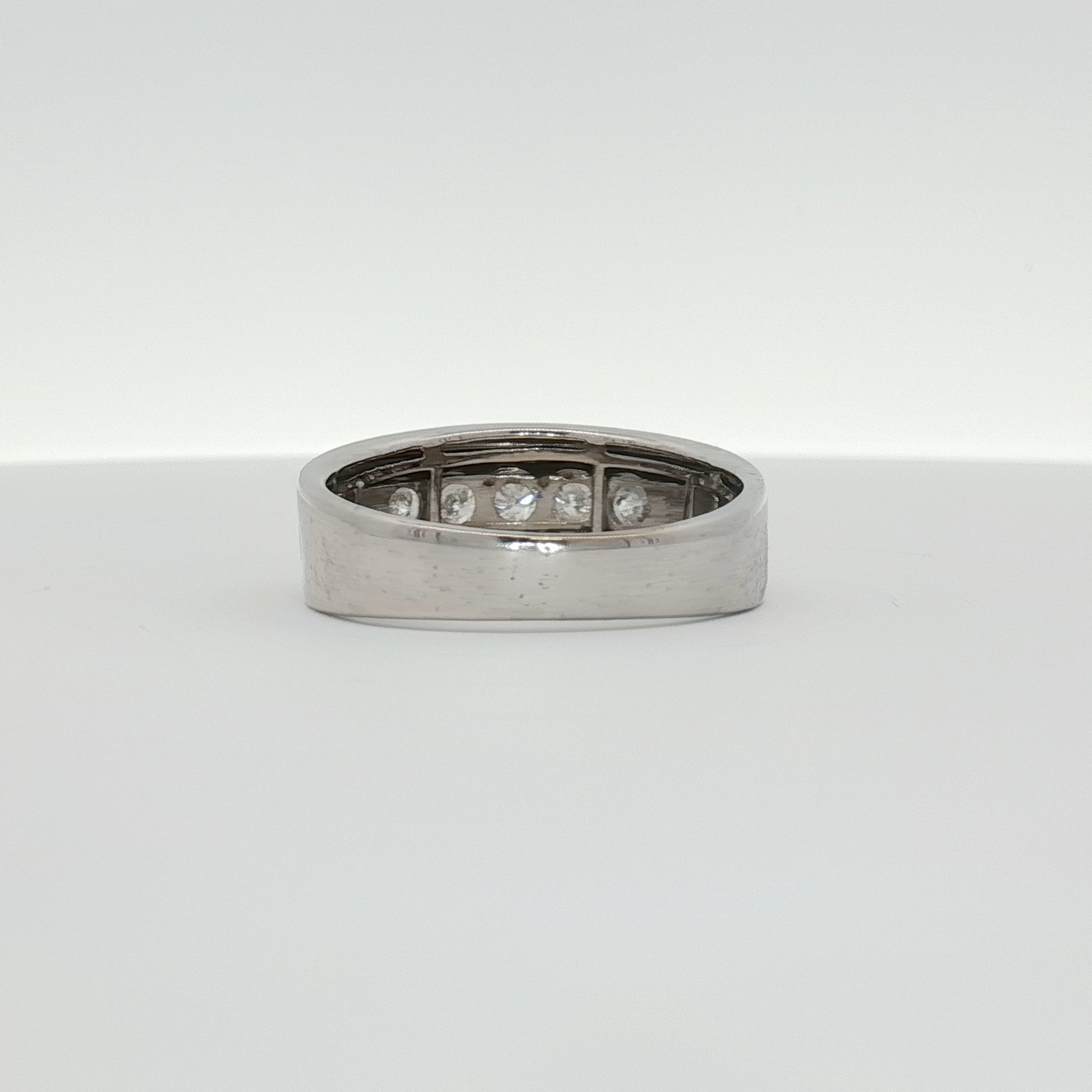 Men's 10K white gold diamond wedding band from Gold & Beyond, featuring a sleek design with sparkling diamonds.