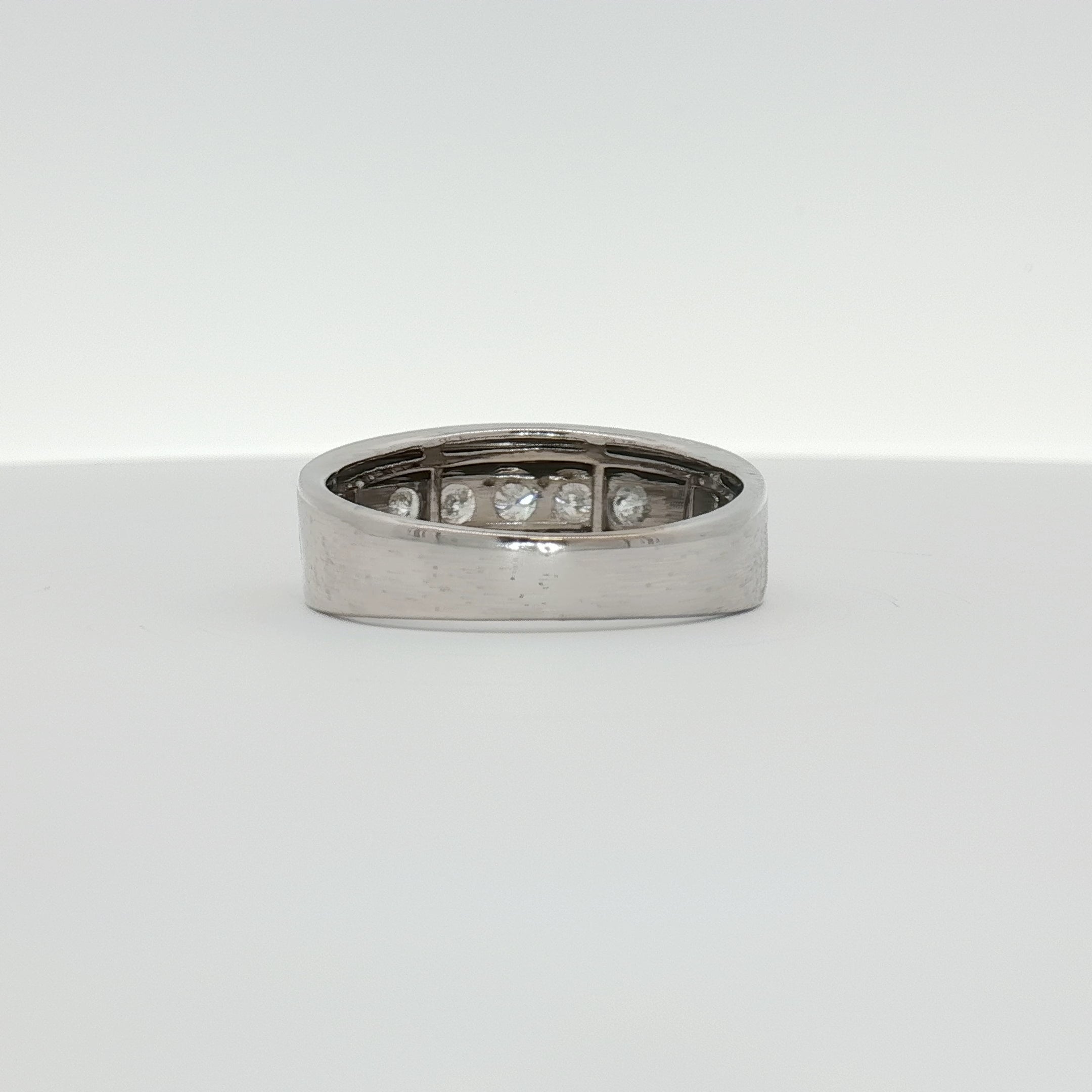 Men's 10K white gold diamond wedding band from Gold & Beyond, featuring a sleek design with sparkling diamonds.