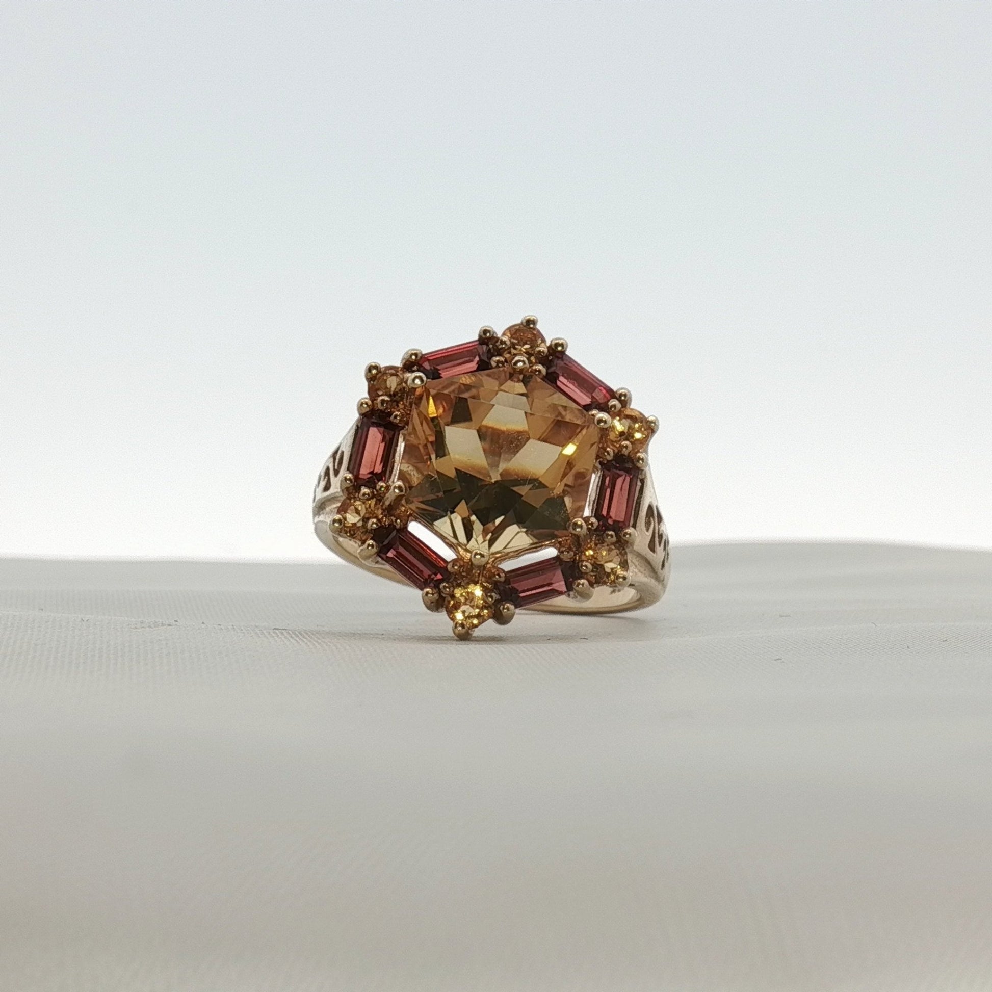 10K yellow gold citrine and accent stone ring featuring a vibrant yellow gemstone and elegant band design.