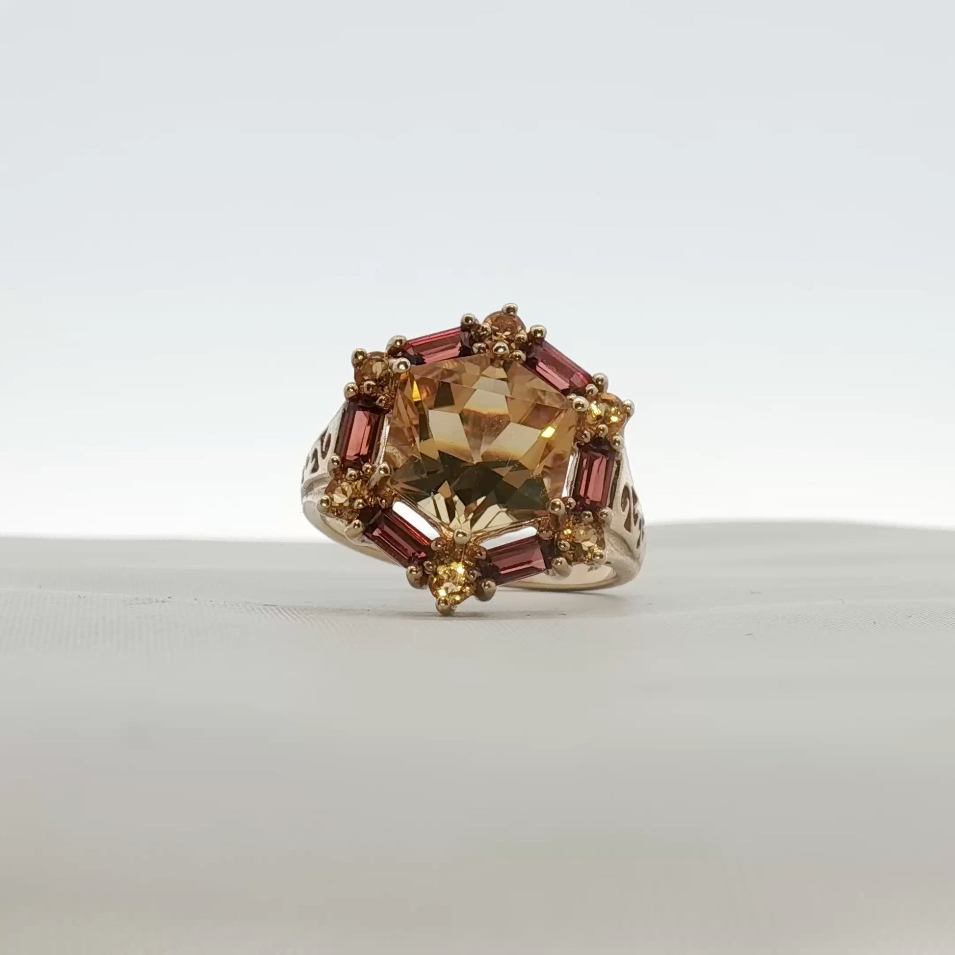Gold & Beyond 10K yellow gold citrine ring with accent stones, showcasing a polished gemstone and elegant jewelry design.
