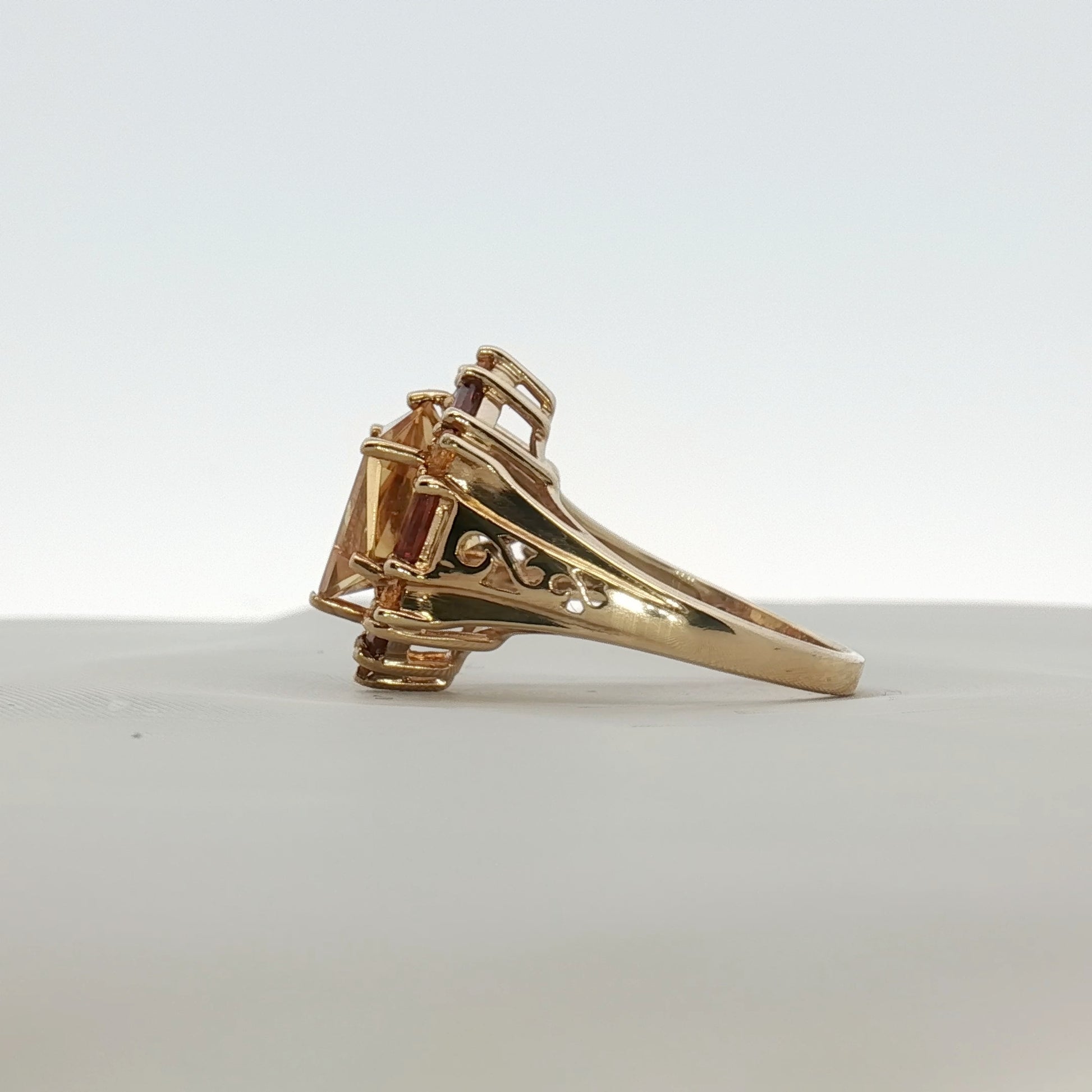 Gold & Beyond 10K yellow gold citrine ring with accent stones, showcasing a vibrant oval citrine gemstone and intricate band design.