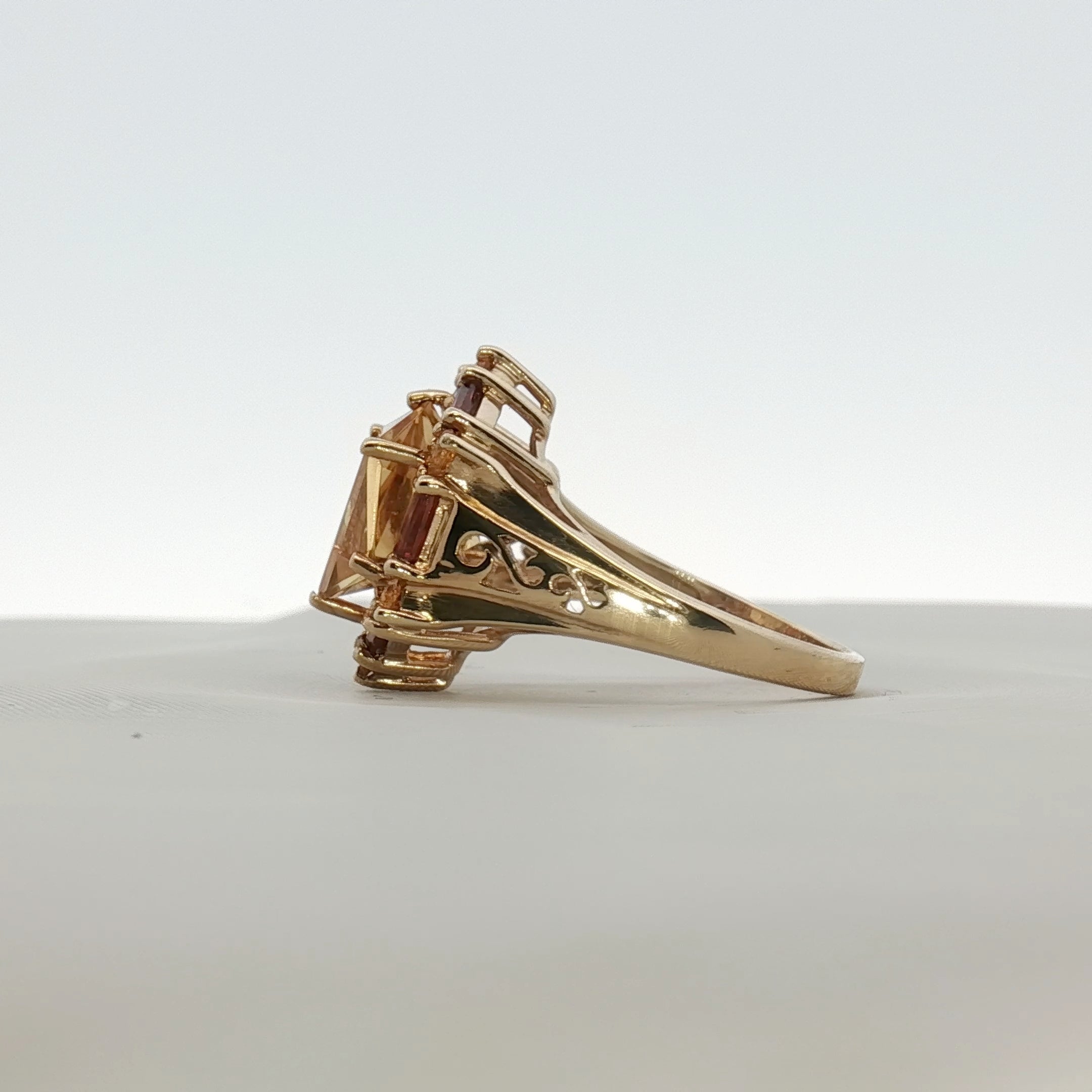 Gold & Beyond 10K yellow gold citrine ring with accent stones, showcasing a vibrant oval citrine gemstone and intricate band design.