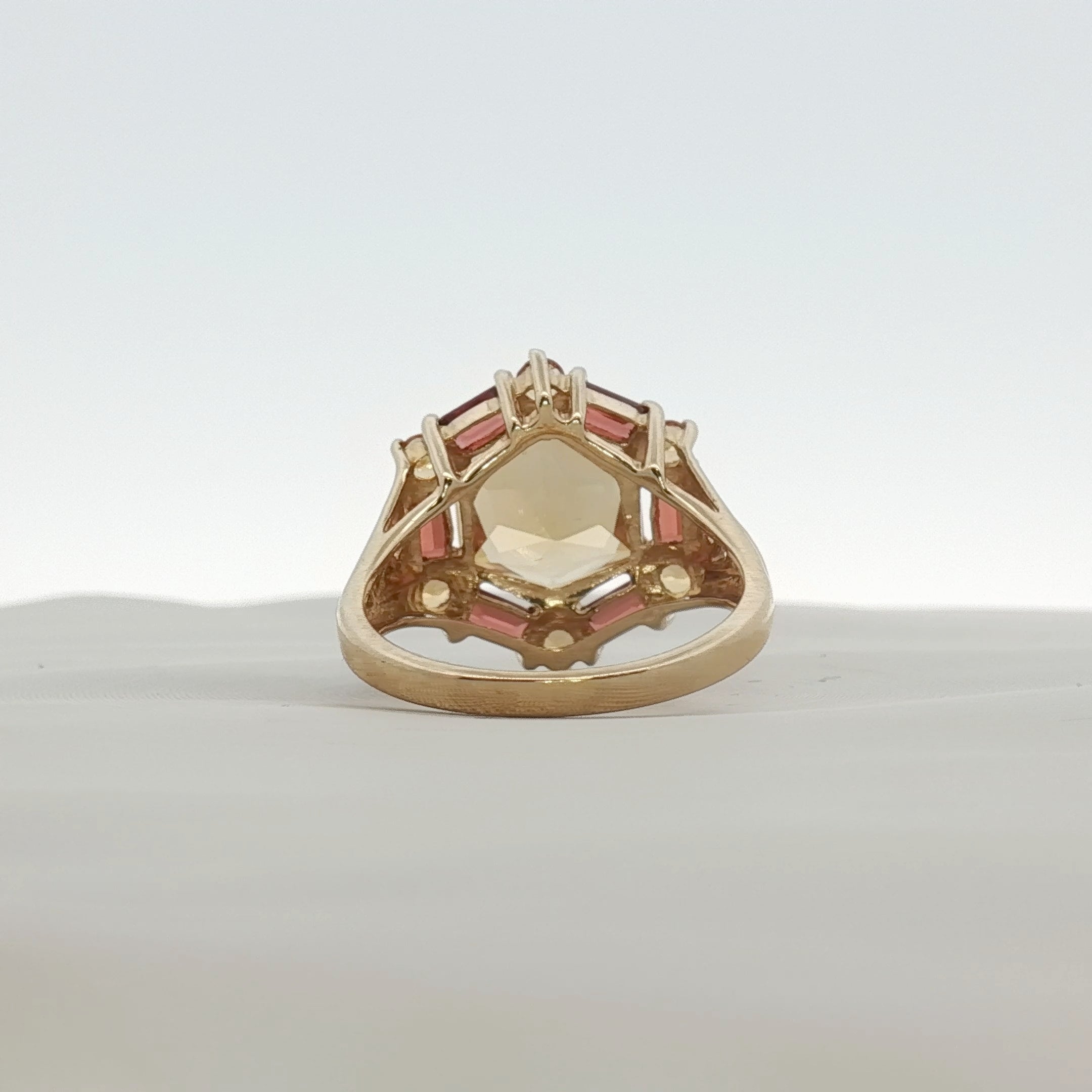 Yellow gold citrine and accent stone ring from Gold & Beyond, showcasing a sparkling gemstone set in a polished jewelry design.