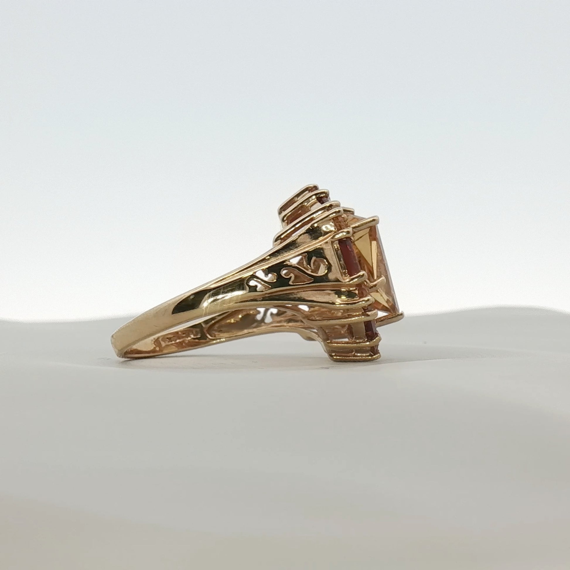 Gold & Beyond 10K yellow gold citrine ring with accent stones, showcasing a vibrant oval citrine gemstone and delicate design.