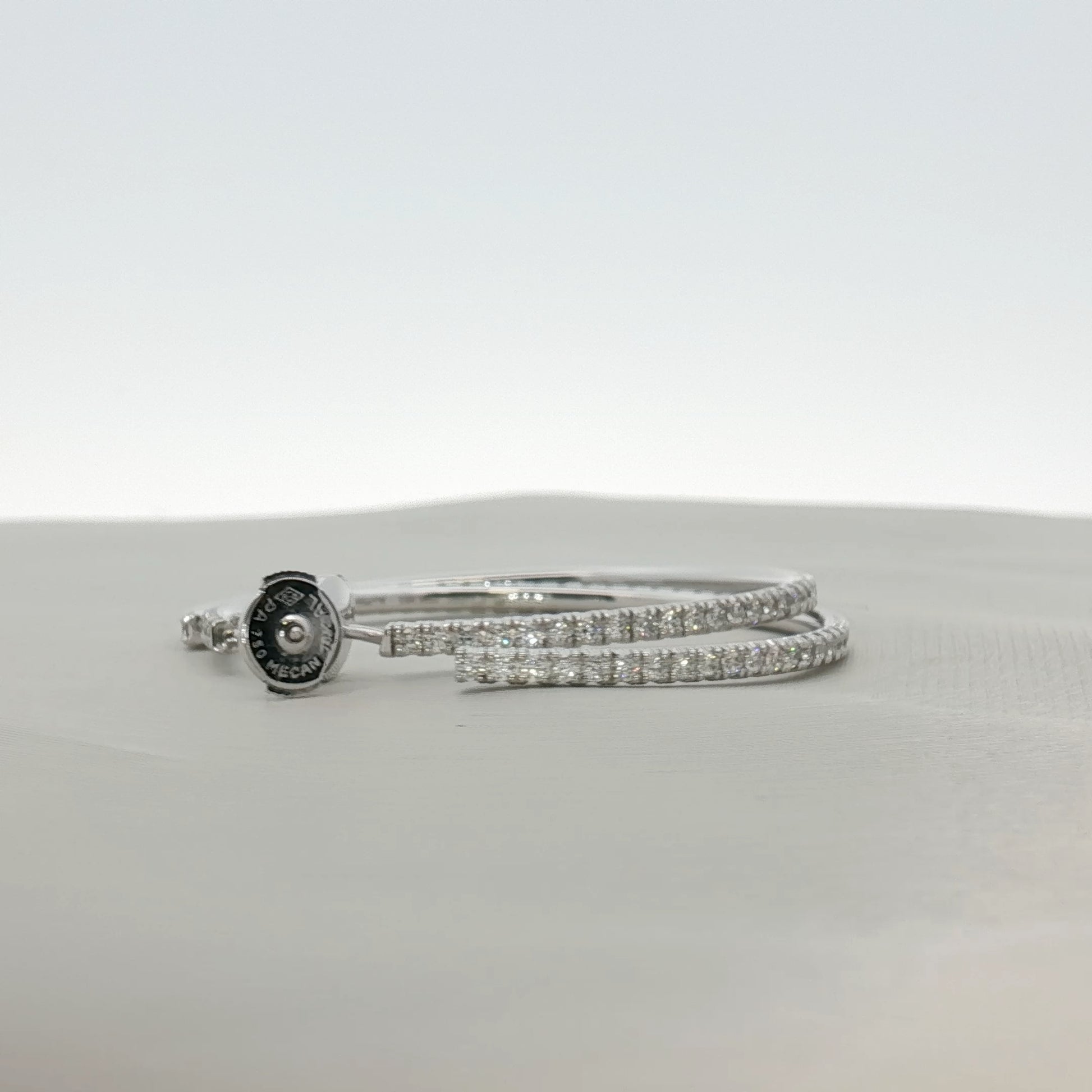 Cartier diamond hoop earrings featuring sparkling diamonds set in gold, elegant jewelry for special occasions.