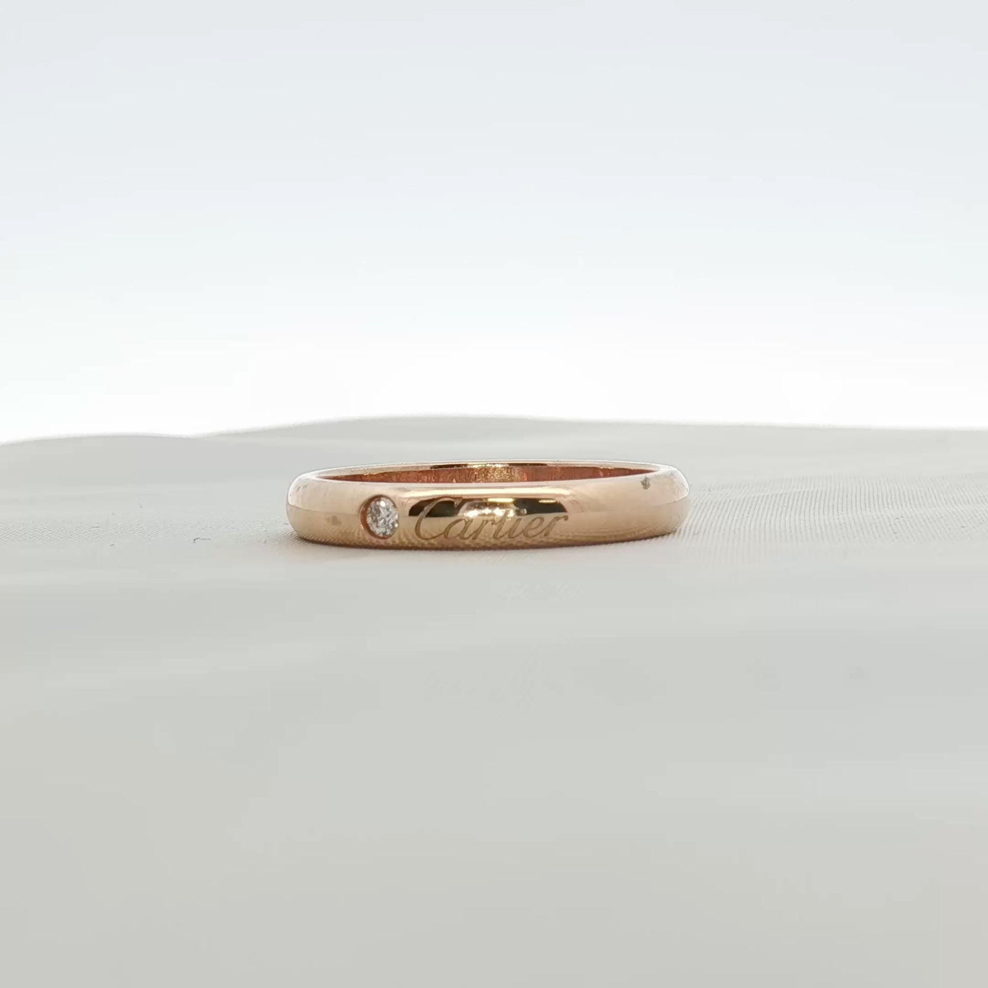 Cartier Love Wedding Band with diamonds, gold jewelry featuring sleek design and sparkling diamond accents.