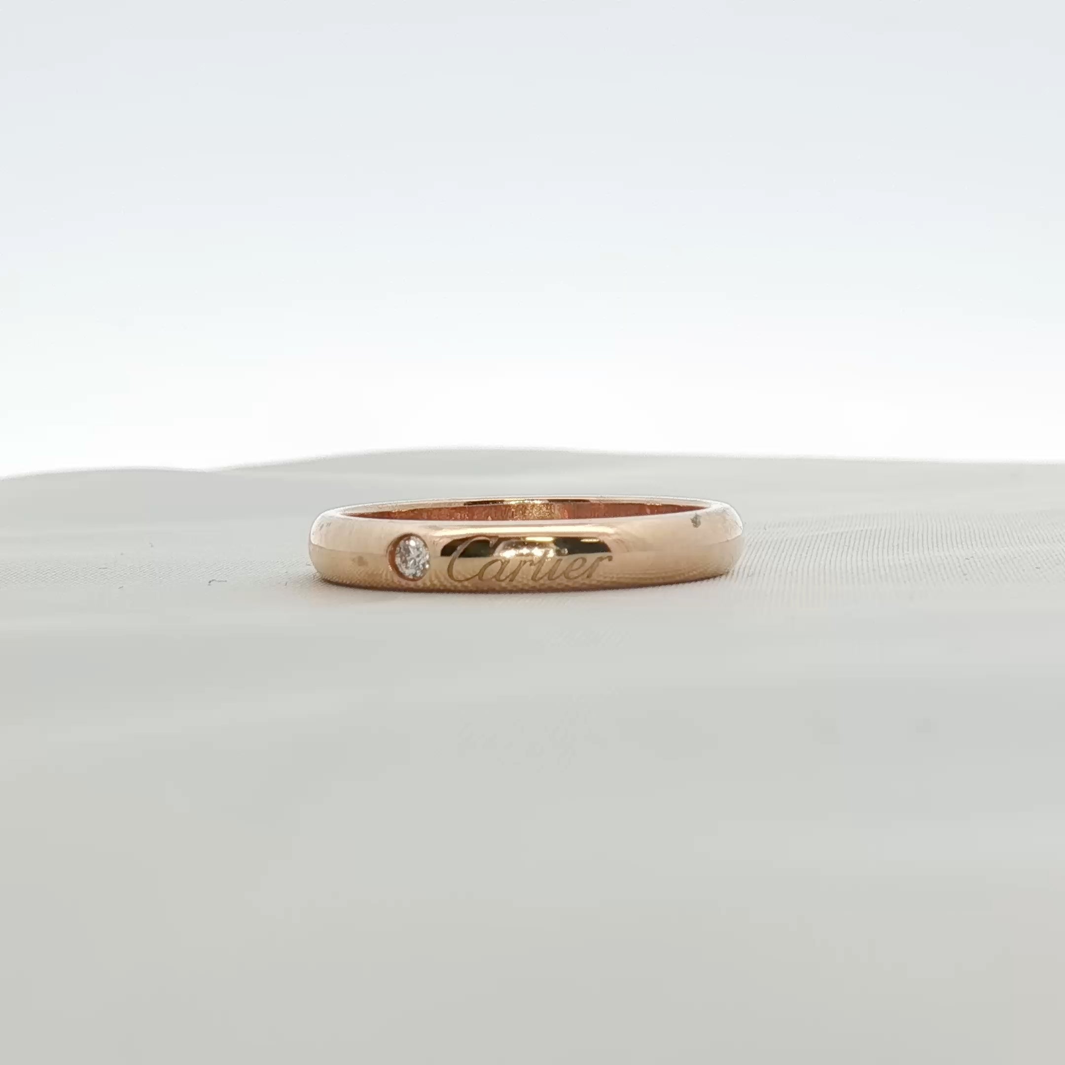 Cartier Love Wedding Band with diamonds, gold jewelry featuring sleek design and sparkling diamond accents.